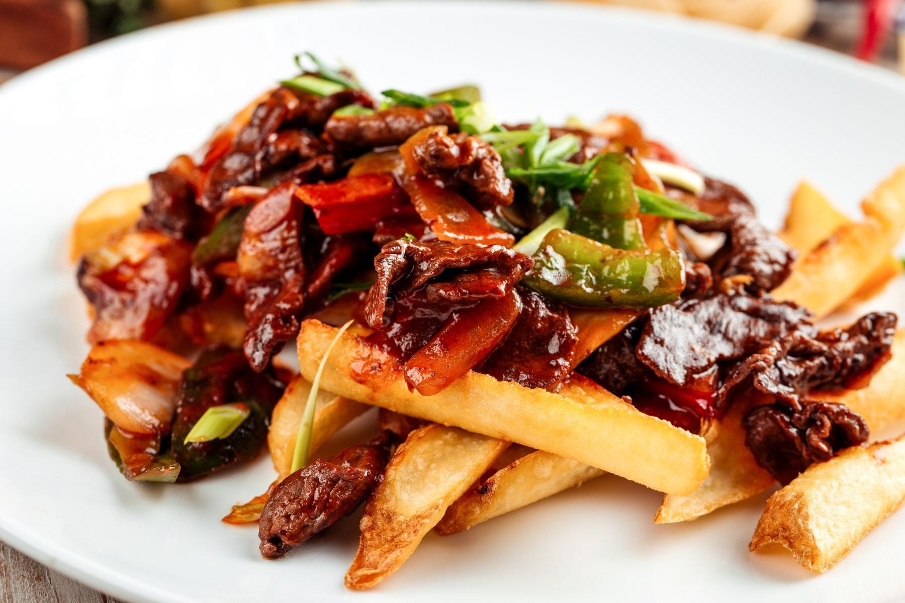 <p>What if you served your <a href="https://www.foodnetwork.com/recipes/food-network-kitchen/beef-stir-fry-with-french-fries-3363773">favourite beef stir-fry</a> on a pile of fries instead of rice? Think about it...</p>