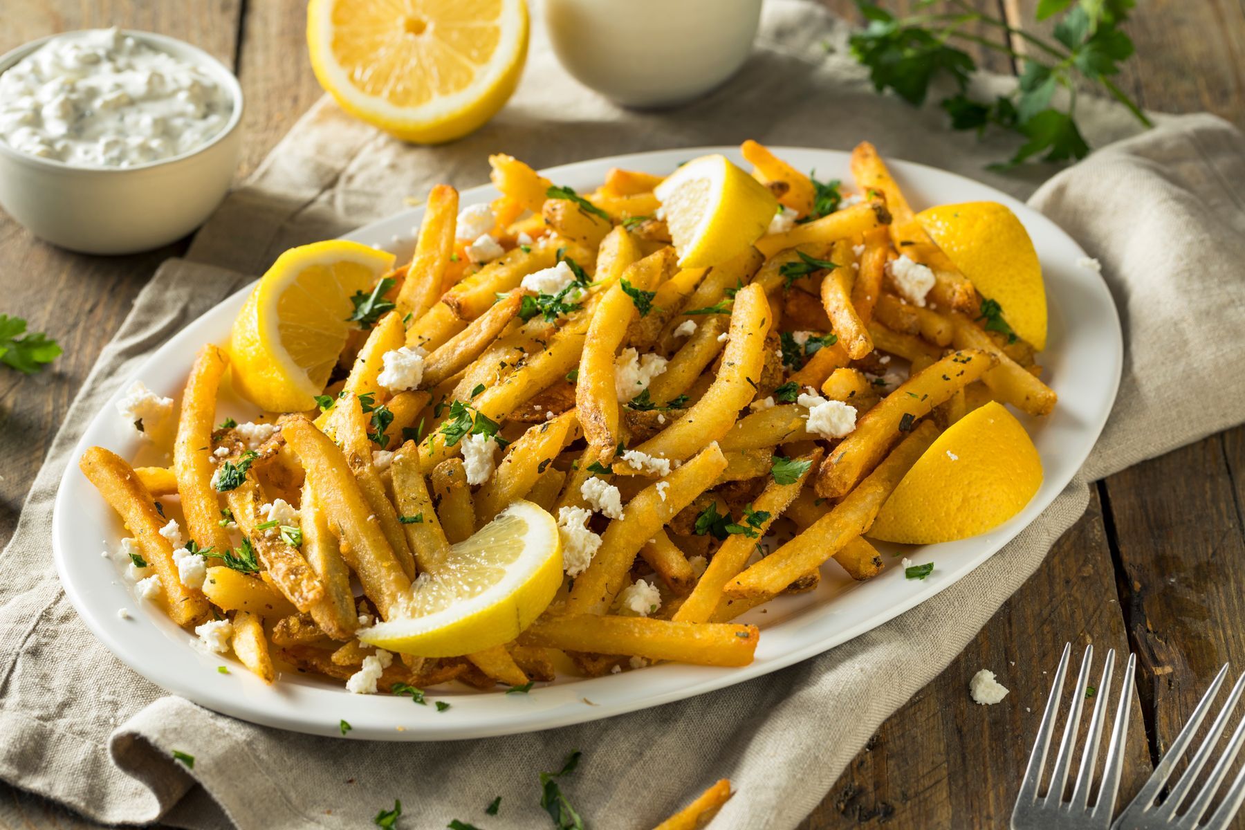 <p>Take a culinary journey with these Greek-inspired fries, better known as <a href="https://www.olivetomato.com/authentic-greek-olive-oil-fries-patates-tiganites/" rel="noreferrer noopener">patates tiganites</a>, made with feta cheese, parsley, and lemon. Serve with a tzatziki-style dip.</p>