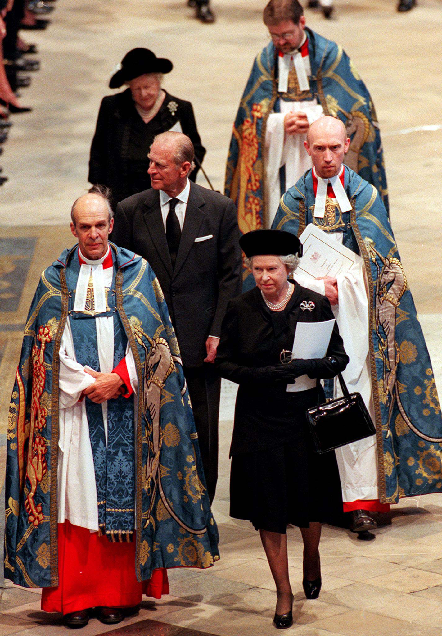 <p>A somber Queen Elizabeth II was joined by husband Prince Philip and mother Queen Elizabeth the Queen Mother as she arrived at Westminster Abbey in London for <a href="https://www.wonderwall.com/celebrity/royal-funerals-through-the-decades-photos-princess-diana-margaret-queen-elizabeth-queen-mother-king-george-prince-philip-monarchs-more-445035.gallery?photoId=445094">the funeral</a> of Princess Diana on Sept. 6, 1997.</p>