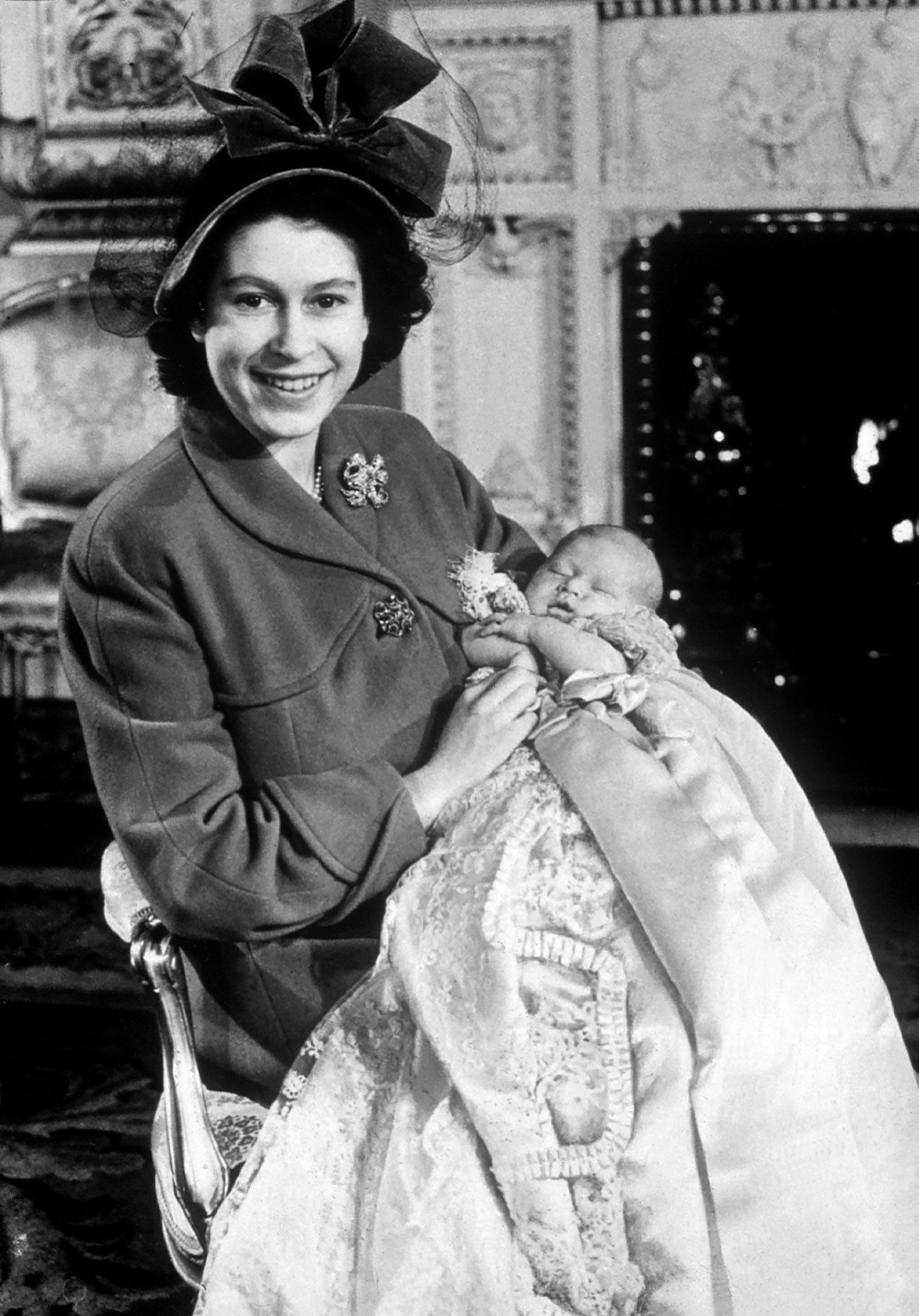 <p>Princess Elizabeth (later Queen Elizabeth II) held her first child, Prince Charles, at his christening in 1948.</p>