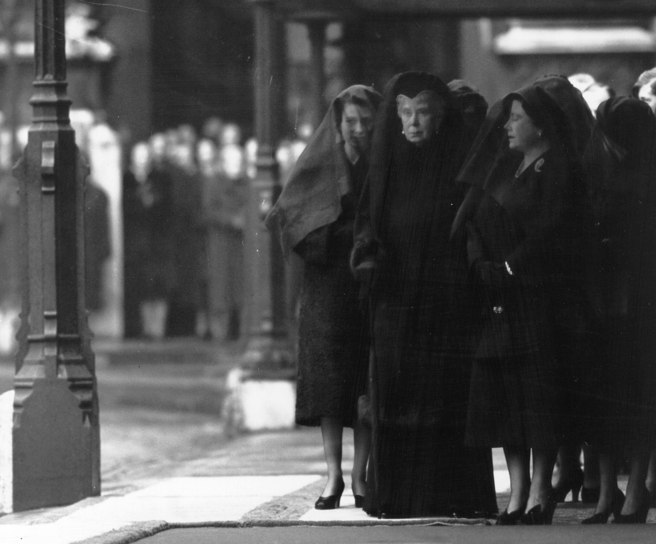 <p>Three queens in mourning -- the new Queen Elizabeth II, her widowed mother, Queen Elizabeth the Queen Mother, and her paternal grandmother, Queen Mary -- waited at London King's Cross railway station for the arrival of the special train bringing the coffin of King George VI from Sandringham on Feb. 11, 1952, ahead of <a href="https://www.wonderwall.com/celebrity/royal-funerals-through-the-decades-photos-princess-diana-margaret-queen-elizabeth-queen-mother-king-george-prince-philip-monarchs-more-445035.gallery?photoId=445054">his royal funeral</a>.</p>