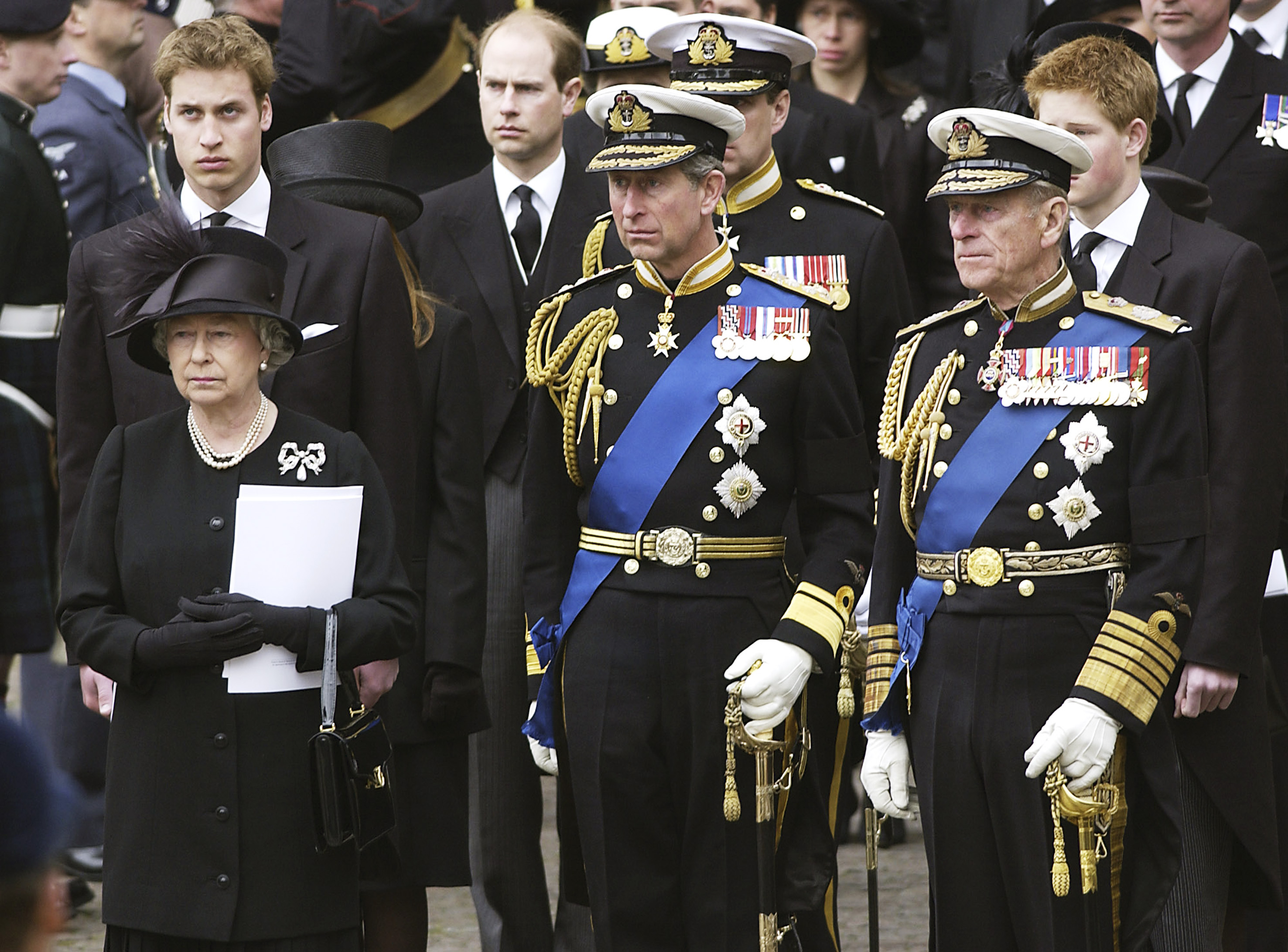 <p>Queen Elizabeth II mourned alongside son Prince Charles, husband Prince Philip and grandsons <a href="https://www.wonderwall.com/celebrity/profiles/overview/prince-william-482.article">Prince William</a> and <a href="https://www.wonderwall.com/celebrity/profiles/overview/prince-harry-481.article">Prince Harry</a> at <a href="https://www.wonderwall.com/celebrity/royal-funerals-through-the-decades-photos-princess-diana-margaret-queen-elizabeth-queen-mother-king-george-prince-philip-monarchs-more-445035.gallery?photoId=445074">the Queen Mother's funeral</a> at Westminster Abbey in London on April 9, 2002.</p>