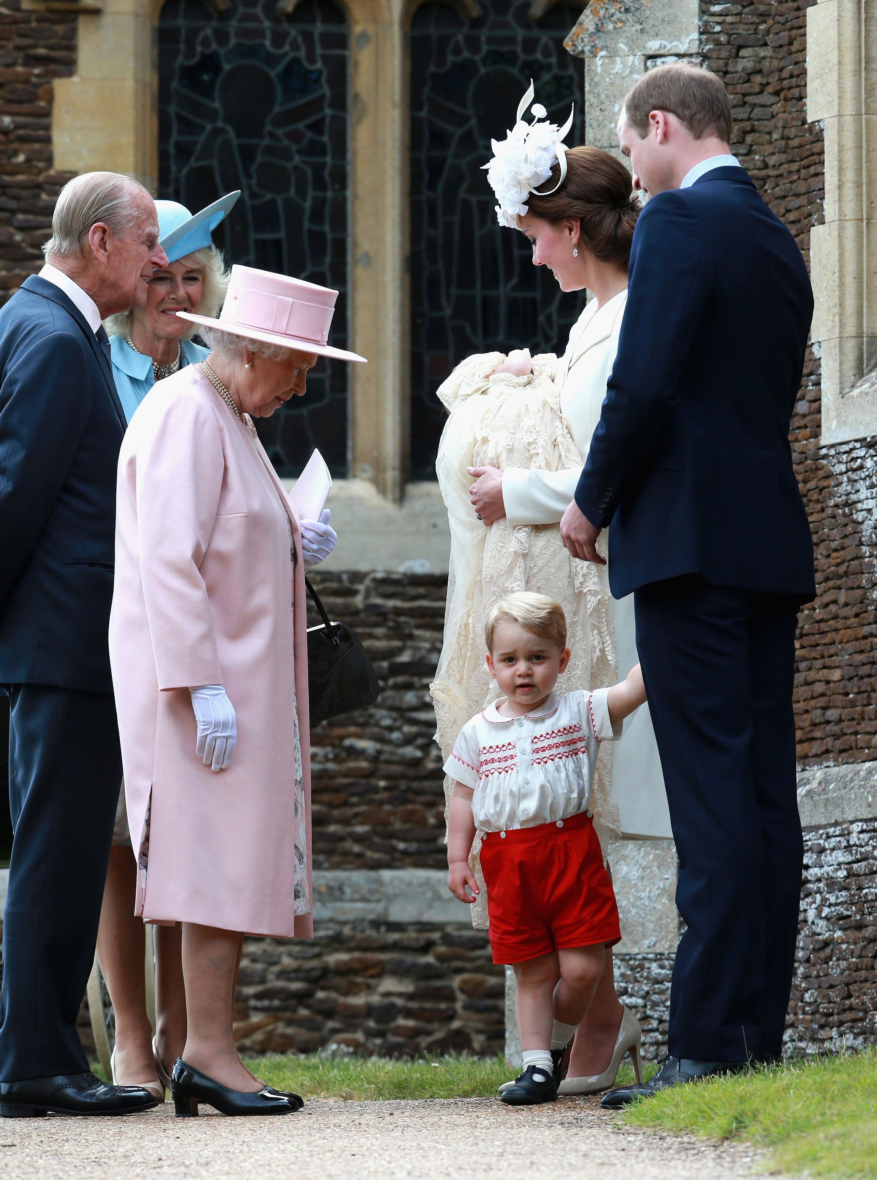 <p>Queen Elizabeth kept an eye on rascally great-grandson and heir Prince George at his little sister Princess Charlotte's christening at the Church of St. Mary Magdalene on the queen's Sandringham Estate in King's Lynn, England, on July 5, 2015.</p>