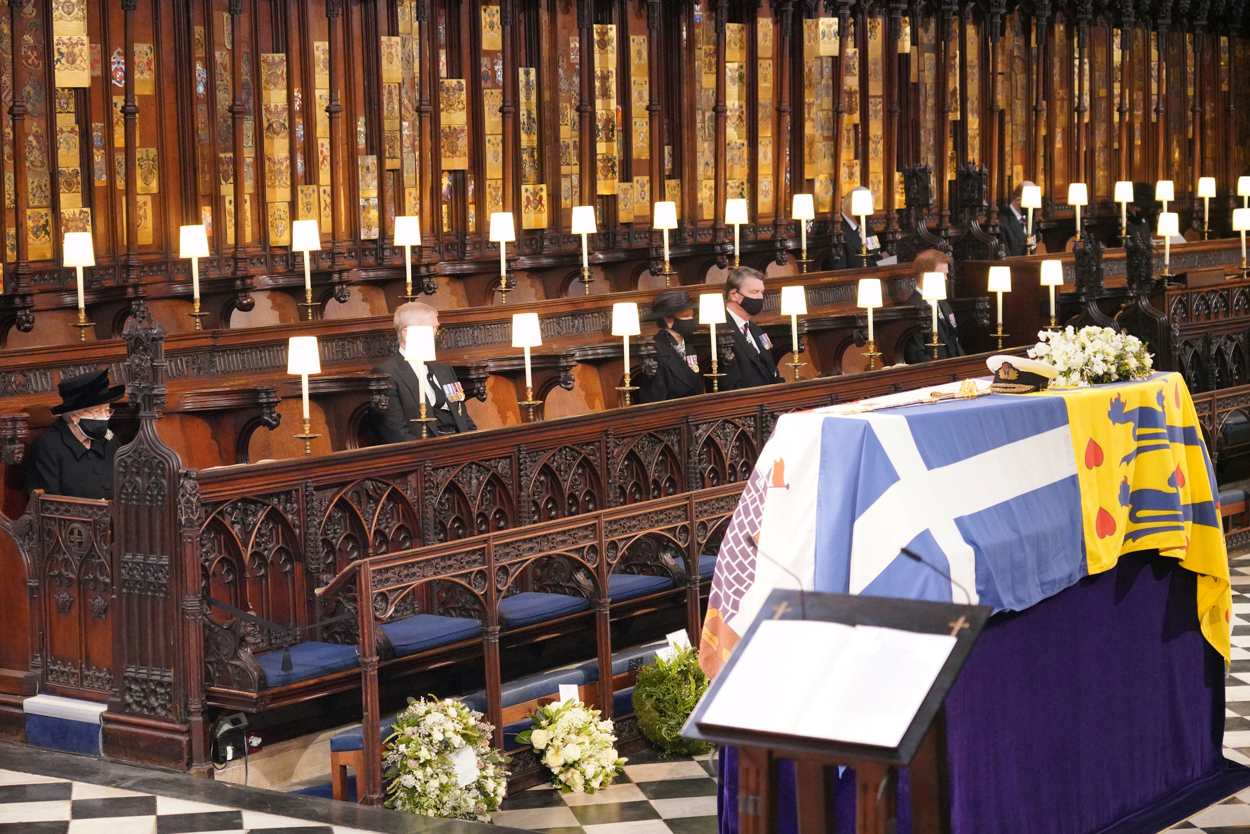 <p>Queen Elizabeth II mourned in front of the coffin of husband Prince Philip -- who died at 99 days earlier -- during <a href="https://www.wonderwall.com/celebrity/royals/prince-philips-funeral-all-the-photos-and-details-447299.gallery">his funeral service</a> at St. George's Chapel at Windsor Castle in Windsor, England, on April 17, 2021.</p>