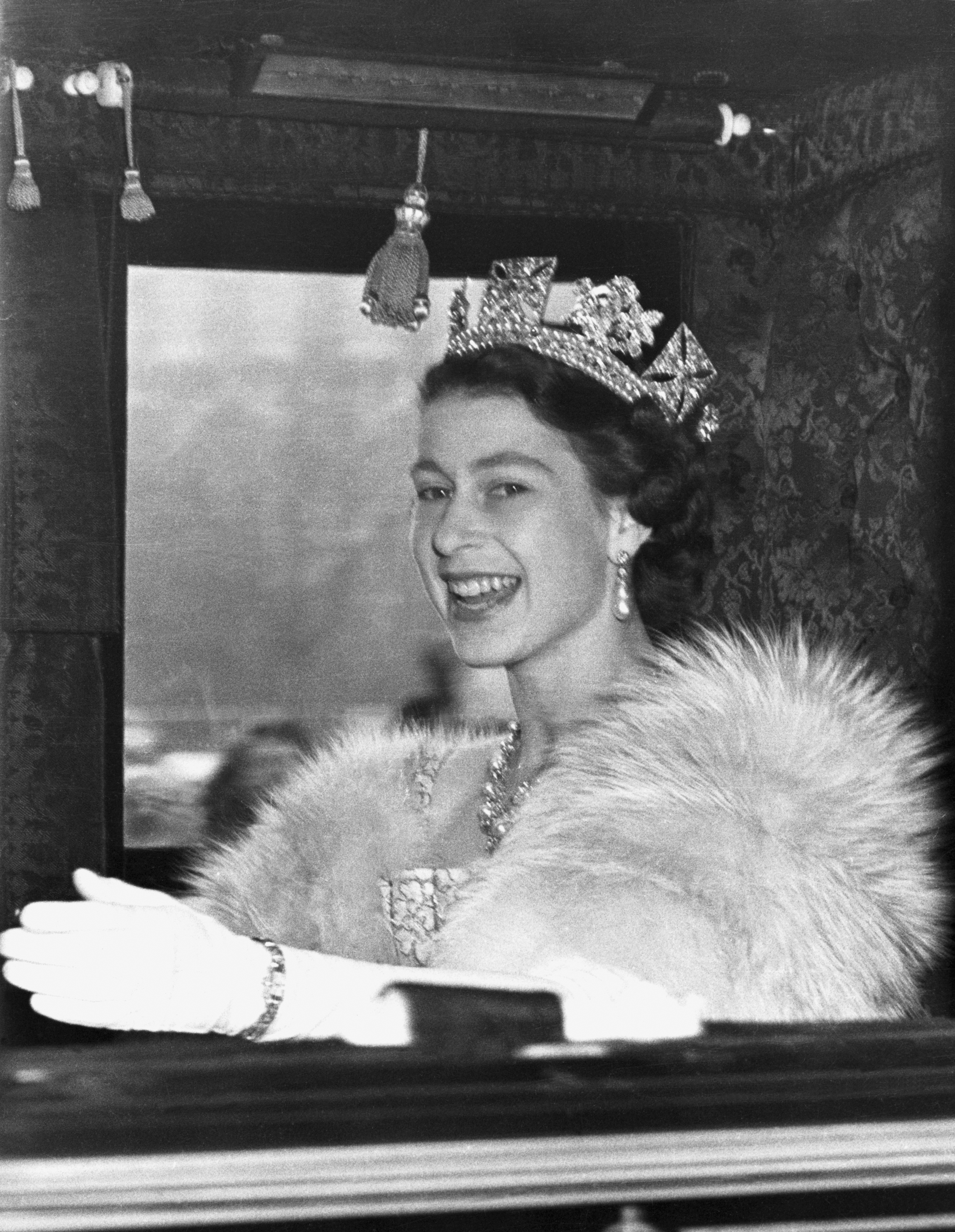 <p>Queen Elizabeth II rode in the State Coach to Westminster in London on her way to the House of Lords to open Parliament in the first year of her reign on Nov. 5, 1952. </p>