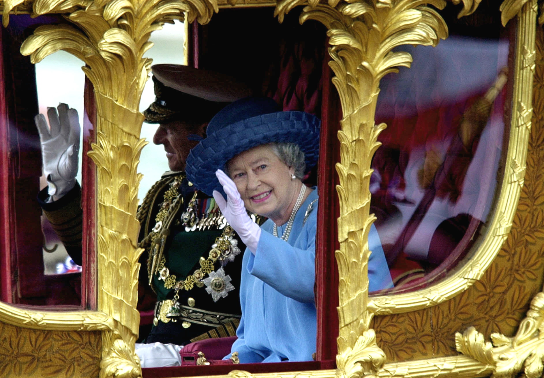 <p>Queen Elizabeth II waved to the crowds with husband Prince Philip by her side as they rode in the Gold State Coach during a procession from Buckingham Palace to St. Paul's Cathedral in London to attend a thanksgiving service to mark her Golden Jubilee -- 50 years on the throne -- on June 4, 2002. </p>