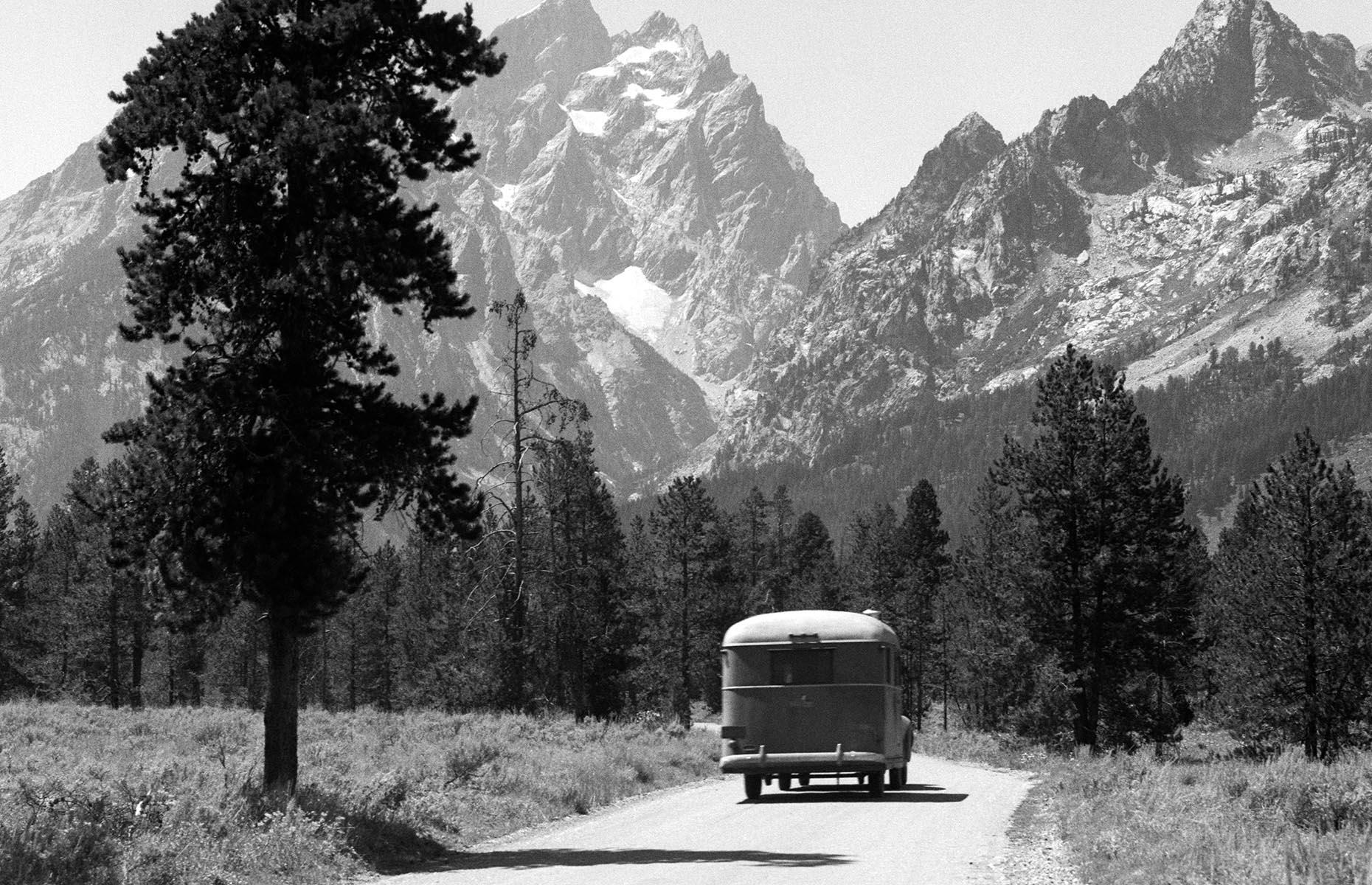 The Second World War put the production of RVs on the back-burner once more, as manufacturing efforts went into producing artillery, military vehicles and aircraft. But this glorious shot from the tail end of the Forties shows America's appetite for the open road was still strong. It shows a car and trailer rattling through Grand Teton National Park in the 1940s.