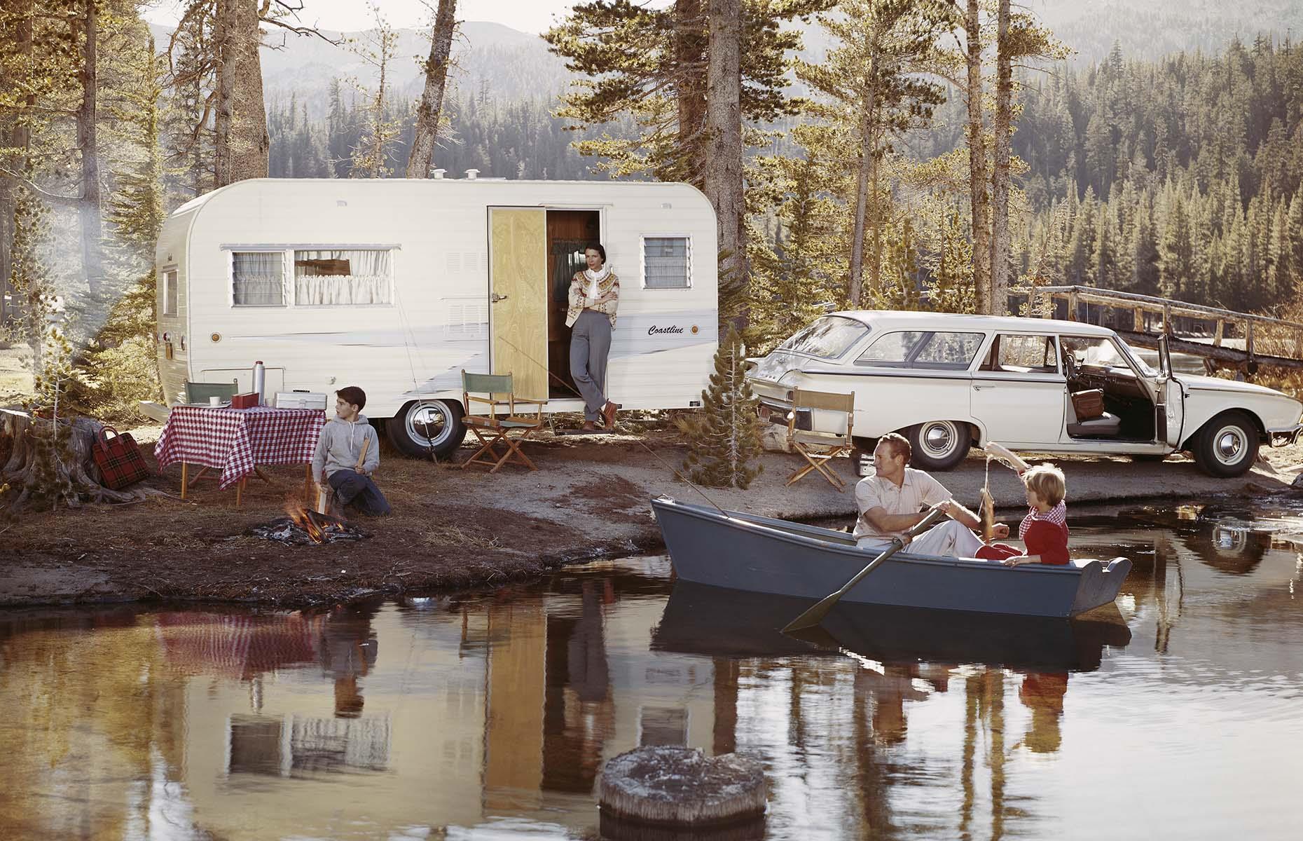 Despite the growing appetite for motorized RVs, the popularity of trailers showed no sign of abating either. This 1950s family have the perfect set-up: a lakeside pitch shaded by trees, a picnic-ready table and a rowing boat for adventures.