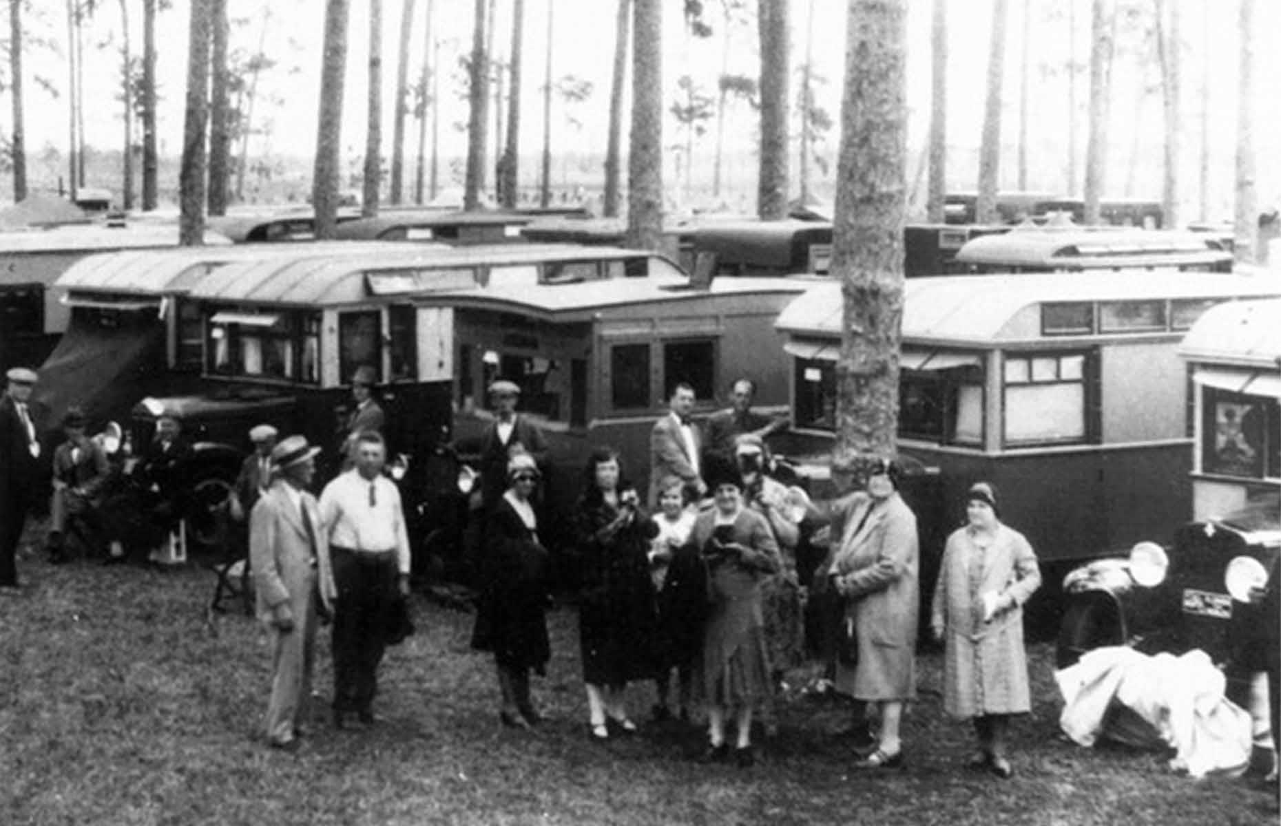 The Tin Can Tourists club was still going strong through the 1930s too. Here smiling camping enthusiasts gather before their RVs at a campsite in Tehachapi, California.