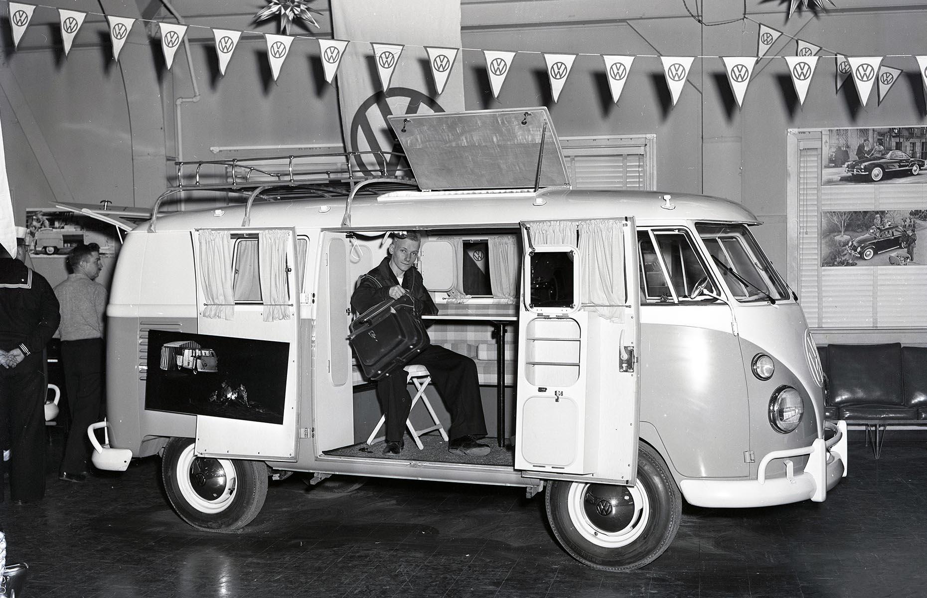 Motorized RVs, though still pricey, continued to gain in popularity in the 1950s, helped along by a post-war manufacturing boom. And it was in this decade that the Volkswagen camper van debuted, representing a major milestone in RV history. The Volkswagen Type 2, which remains a classic today, is pictured here on display at an auto showroom in 1958. It's still loved for its streamlined design, with camping necessities like a bed and a stove.