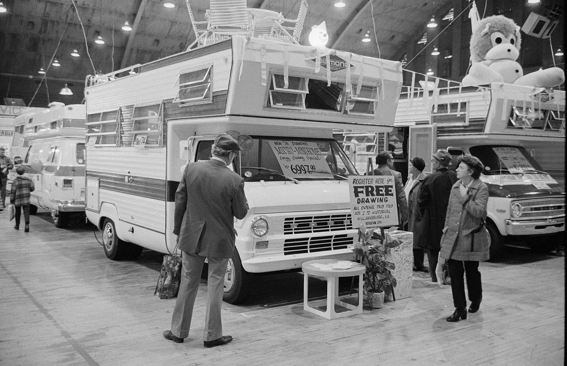 By the mid-1970s, RVs were part of the American psyche. This motorhome showroom from the decade doesn't look so different from those of the modern day. Potential buyers wander around the mammoth vehicles which come complete with roof decks and are described as 'micro mini-homes'.
