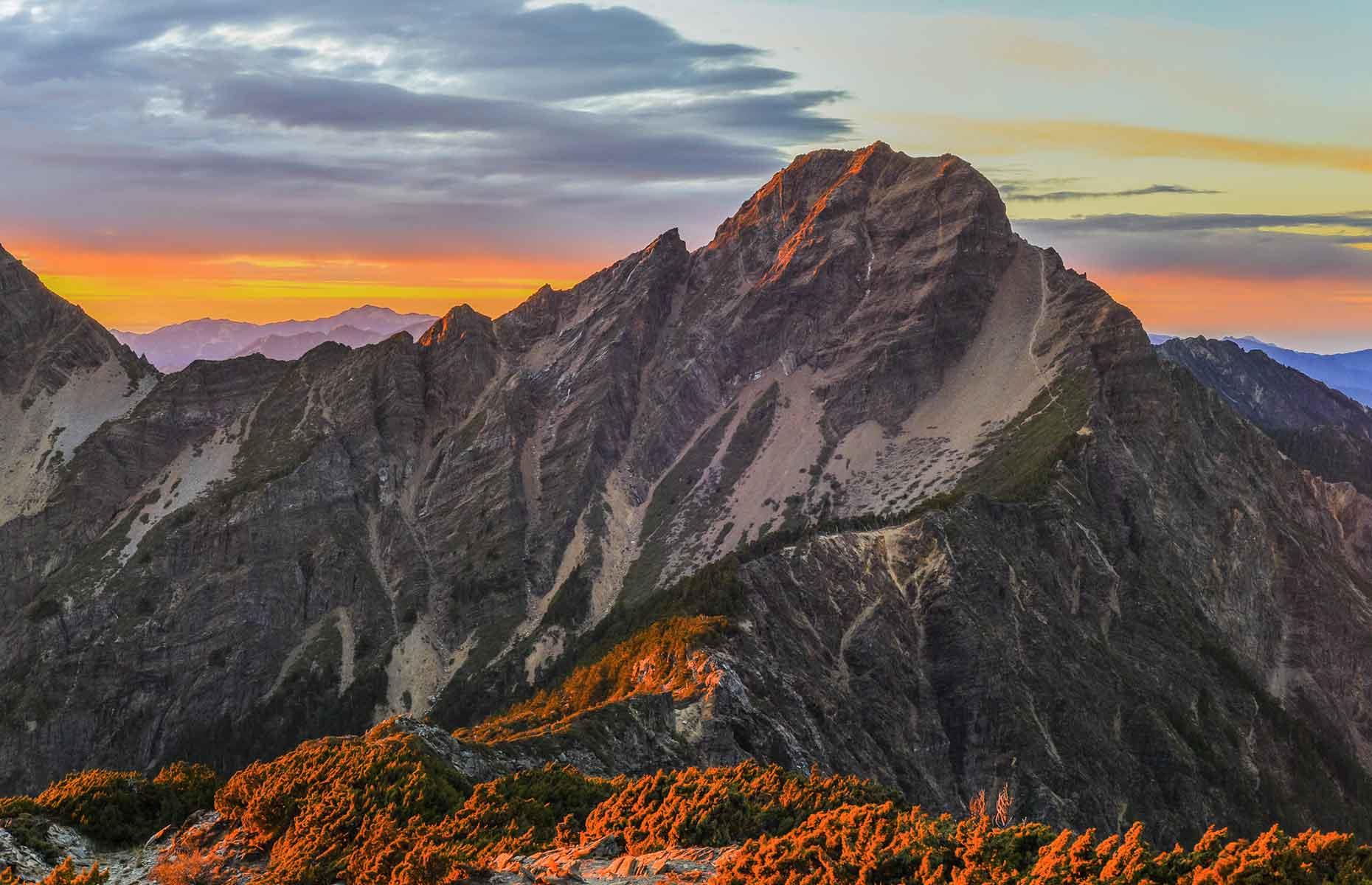 <p>Walk among the clouds at Jade Mountain (or Yushan), Taiwan’s highest peak at 13,000 feet (3,962m) above sea level. Hikers can follow a well-maintained trail that weaves through thickets of bamboo and cedar trees. The hike can be covered in two days with an overnight stay at Paiyun Lodge and it’s certainly worth the early start on the second morning to watch a captivating sunrise like no other. There’s all the more reason to celebrate when you see the marker stone at the top. </p>  <p><a href="https://www.loveexploring.com/gallerylist/95883/secrets-of-the-worlds-most-beautiful-mountains"><strong>Discover the secrets of the world’s most beautiful mountains</strong></a></p>