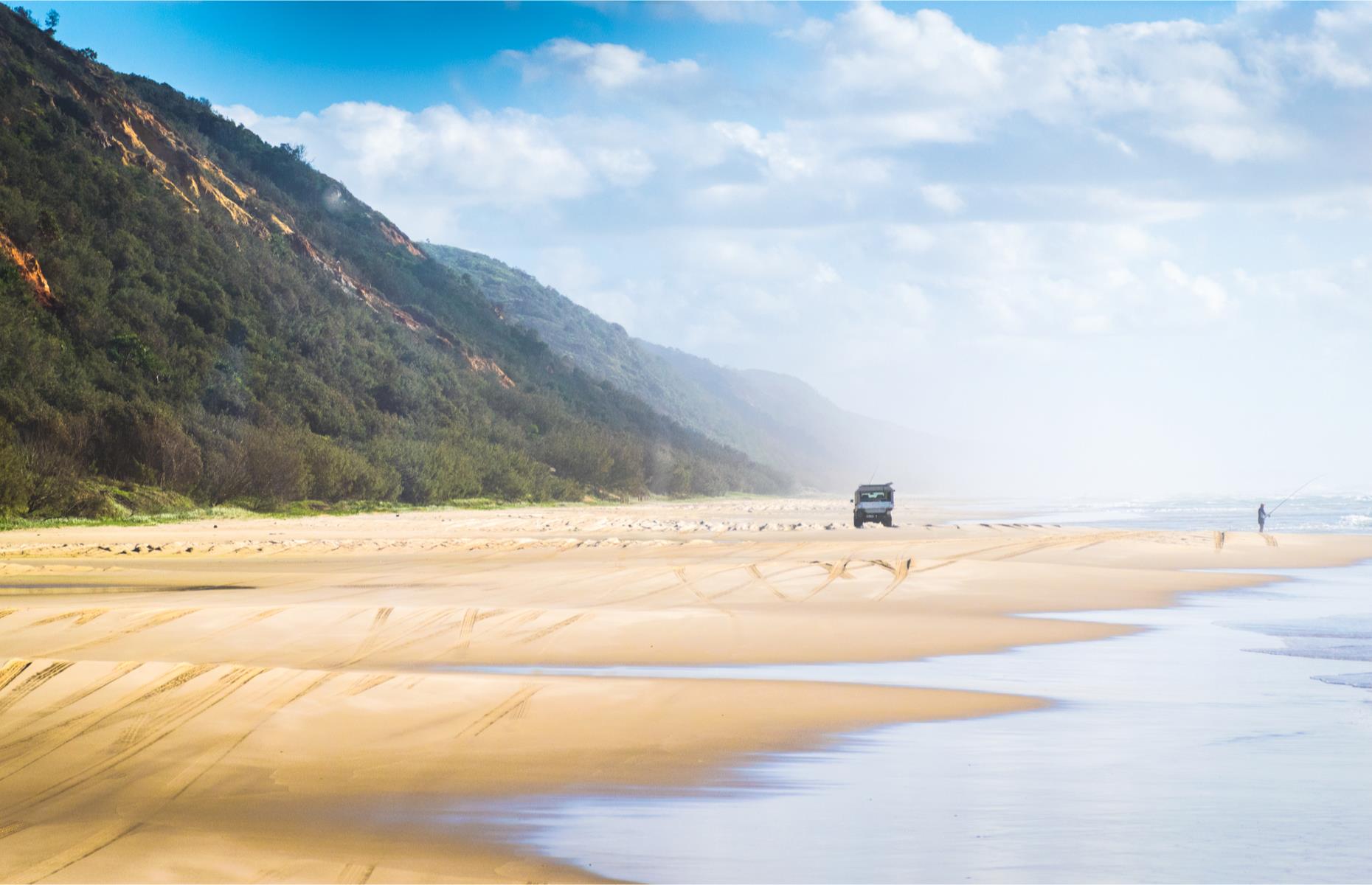 <p>There are beach roads and then there are actual beach roads. Follow the 236-mile (380km) <a href="https://www.queensland.com/au/en/plan-your-holiday/road-trips/great-beach-drive-road-trip-5-days">Great Beach Drive</a> to quite literally track your way along the sand on Queensland's sandy highways. Start in Noosa, where you’ll need to hire a four-wheel drive (make sure the right vehicle access permits are included), then cross Noosa River on the vehicle ferry at Tewantin. From here, take the third beach access road and hit the sands. You’ll go through the Great Sandy Strait Biosphere – stop at Teewah Beach to marvel at its multicolored sand cliffs then carry on north on the Leisha Track to cut through the sand dunes to the small coastal resort of Rainbow Beach. </p>
