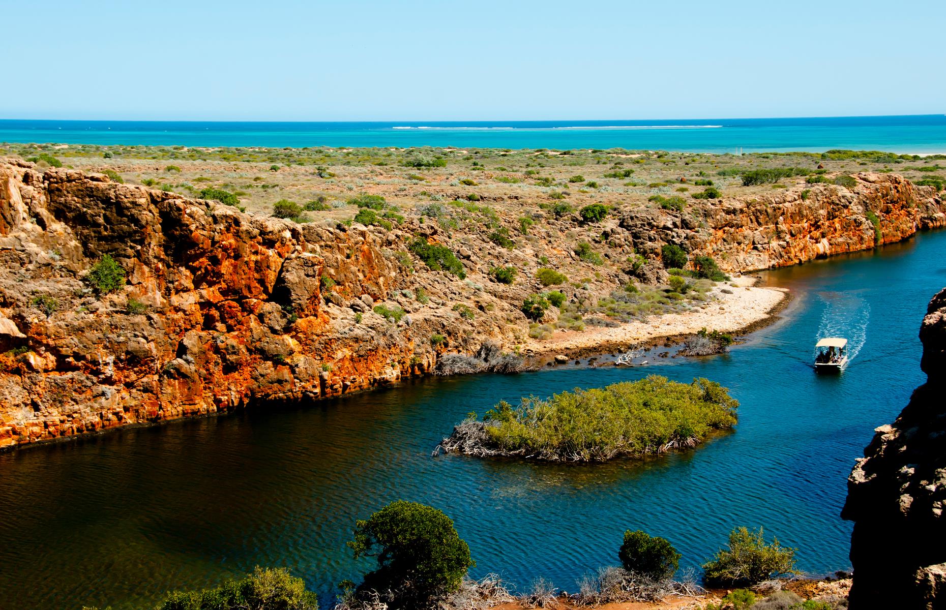 <p>Next up are the wonders of the Shark Bay World Heritage Area: stroll across Shell Beach, meet the dolphins of Monkey Mia and see some of the oldest living organisms on the planet, the stromatolites at Hamelin Pool. From here it’s back on the North West Coastal Highway to Carnarvon and Coral Bay, where you can swim straight from the beach and out onto the Ningaloo Reef, the world’s longest fringing coral reef. Cape Range National Park just outside Exmouth is a suitably show-stopping end point with its ocher-colored gorges and reef-fringed turquoise lagoons. Go between March to July, if you can, and you’ll be there when whale sharks arrive to feed on plankton. </p>