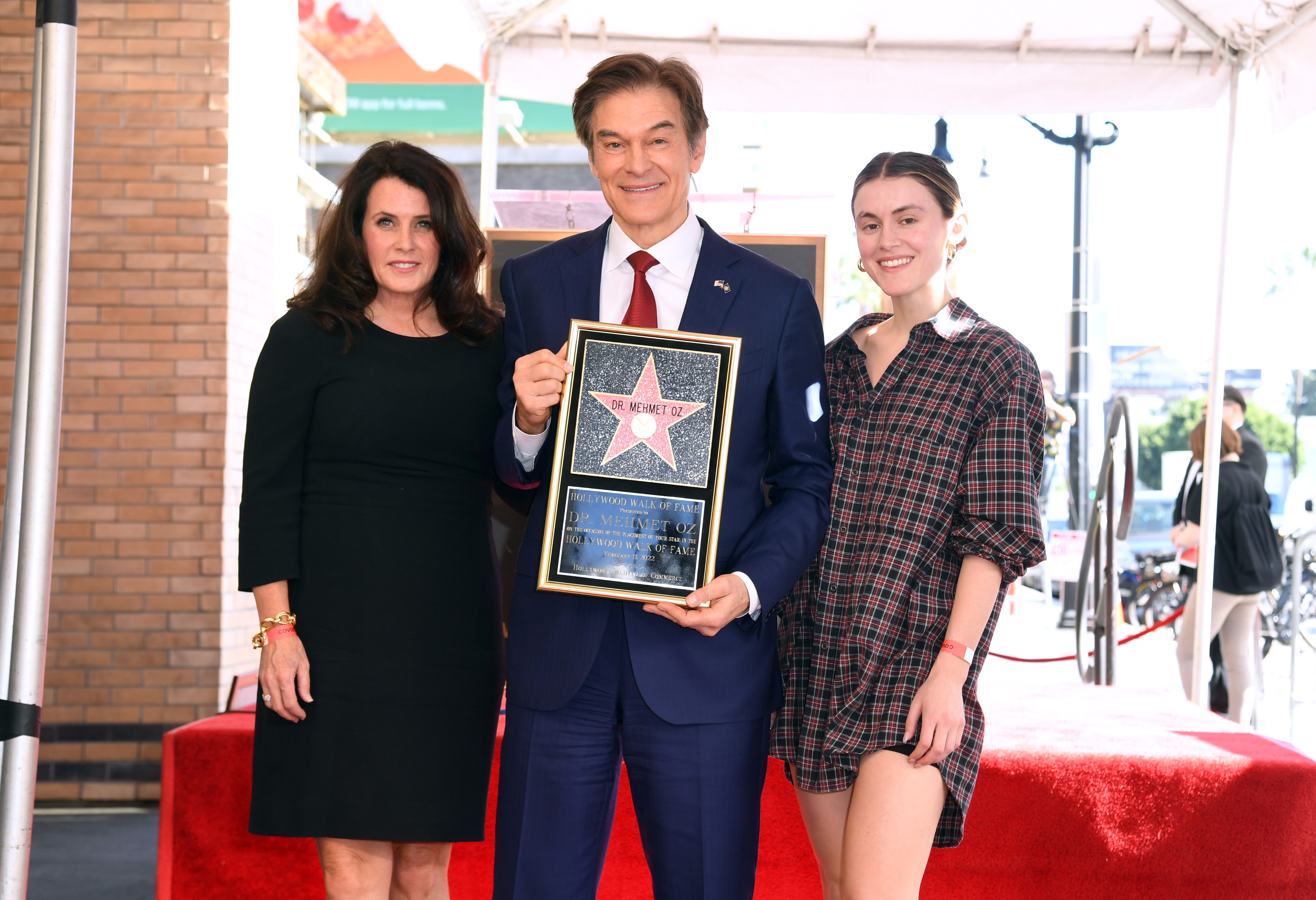 <p>Dr. Mehmet Oz was flanked by wife Lisa Oz and their youngest daughter, Zoe Oz -- who was born in the mid-'90s -- at his <a href="https://www.wonderwall.com/celebrity/photos/hollywood-walk-fame-star-ceremony-best-celeb-photos-3015941.gallery">Hollywood Walk of Fame star ceremony</a> on Feb. 11, 2022. Zoe, a Harvard University graduate like her dad, worked in fashion design and brand development at companies like Theory and Helmut Lang as well as in medical research labs before co-founding and serving as chief marketing officer at Kairos, a portfolio of brands across healthcare and financial services that works to make life more affordable for younger generations.</p>