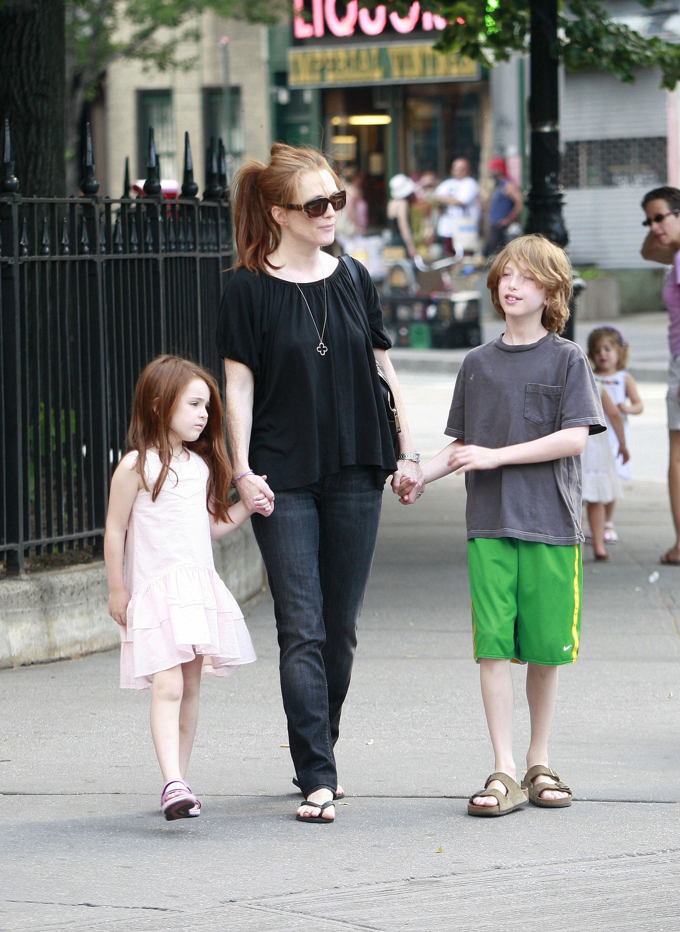 <p><a href="https://www.wonderwall.com/celebrity/profiles/overview/julianne-moore-1047.article">Julianne Moore</a> is seen here on a walk with kids Liv Freundlich and Caleb Freundlich in New York City's West Village on June 30, 2007. Keep reading to see what the redheads look like now...</p>