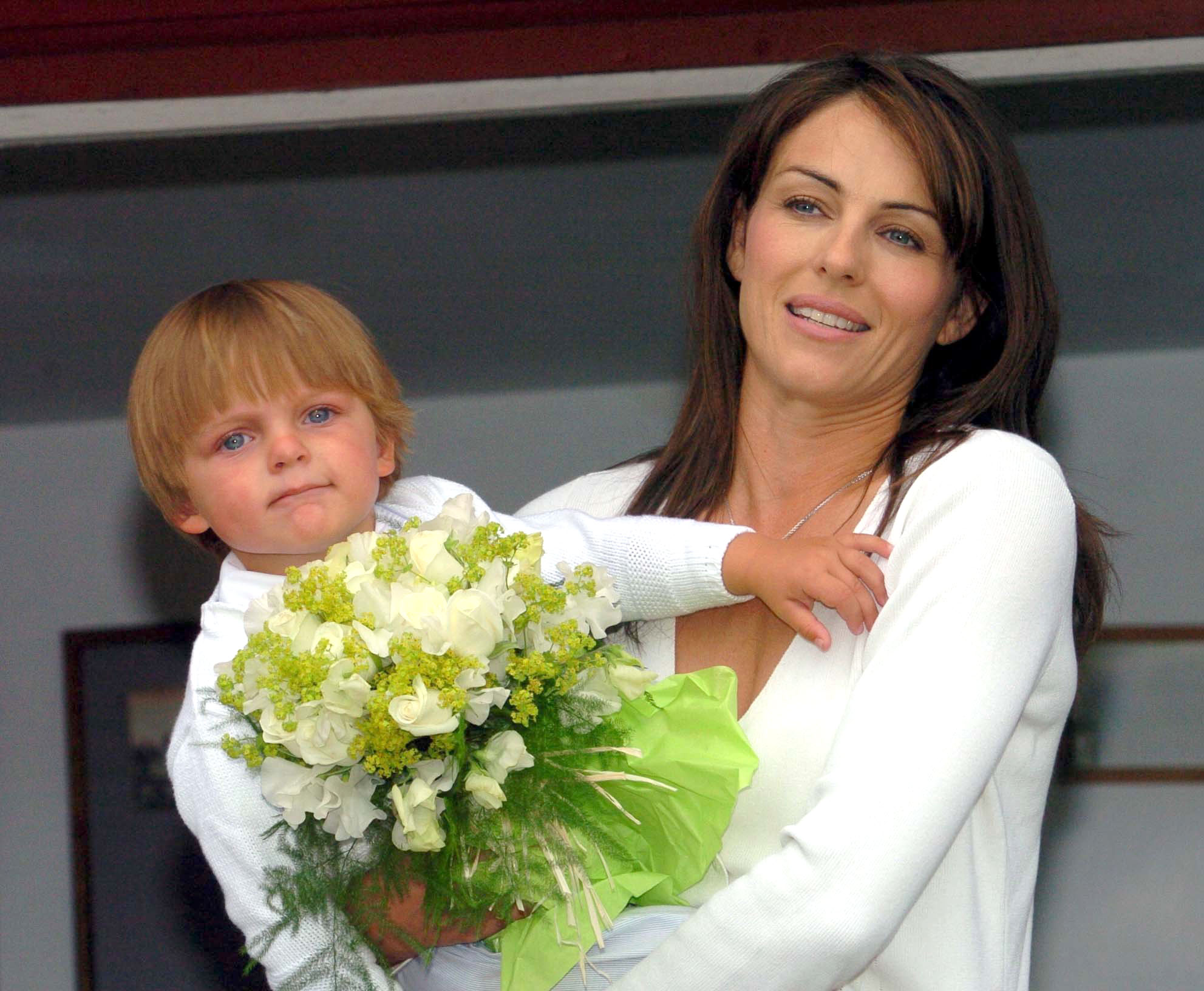 <p>Single mom Elizabeth Hurley held her then-14-month-old son, Damian Hurley -- whose dad is screenwriter-producer and philanthropist Steve Bing, who died in 2020 -- during the Ampney Crucis Village Fete in England's Cotswold District on June 26, 2004. Keep reading to see gorgeous Damian at 19...</p>
