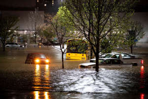 Cars are stranded in a Walmart parking lot after a flash flood in Nashville, Tenn., on March 28, 2021. Weather extremes, as well as drought, wildfire, flooding and diminished air quality, will increase in frequency and intensity in North America as global warming accelerates, according to the United Nations Intergovernmental Panel on Climate Change.