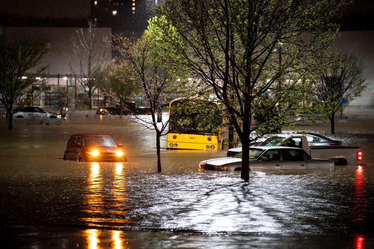 Cars stranded in a Walmart parking lot after a flash flood on Nolensville Pike in Nashville, Tennessee, on March 28, 2021. Weather extremes like this, as well as drought, wildfire, flooding and diminishing air quality will increase in frequency and intensity in North America the coming years as global warming accelerates, according to the United Nations Intergovernmental Panel on Climate Change report.