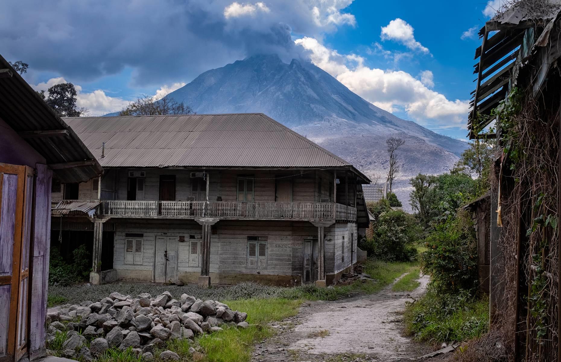 <p>Located in North Sumatra along the Ring of Fire, the 8,530-foot (2,600m) high Mount Sinabung had been dormant for more than 400 years before it broke its quiet spell in 2010. Since then, there have been several major blasts, and in 2014, 16 people died after <a href="https://www.theguardian.com/world/2014/feb/02/indonesian-volcano-eruption-claims-lives-sinabung">authorities allowed evacuated residents to return</a> to their homes prematurely.</p>