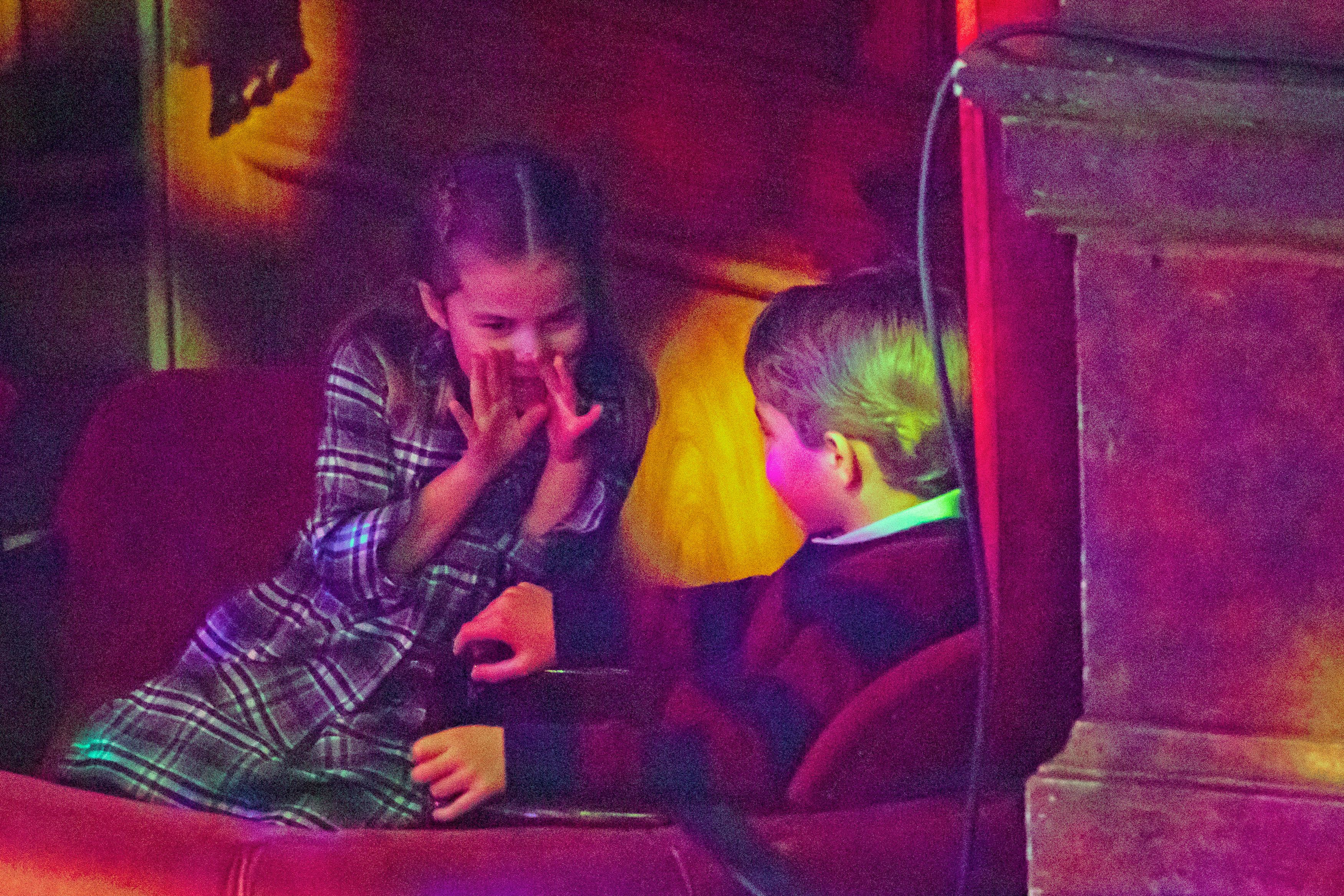 <p>Princess Charlotte whispered to big brother George in their box at a Dec. 11, 2020, pantomime performance at London's Palladium Theatre hosted by The National Lottery to thank key workers and their families for their efforts throughout <a href="https://www.wonderwall.com/celebrity/photos/stars-diagnosed-with-covid-19-428711.gallery">the COVID-19 pandemic</a>. </p>