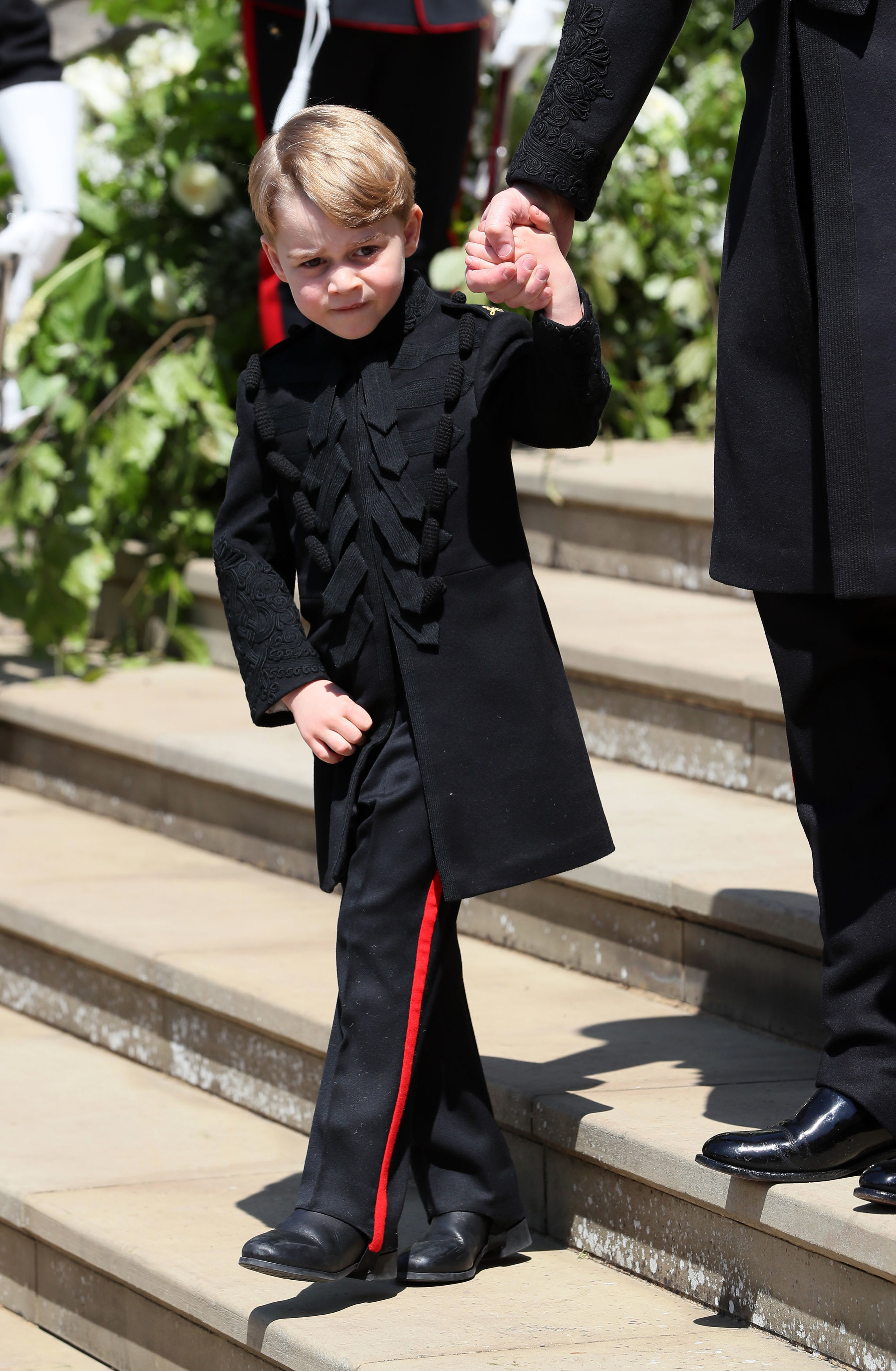 <p>Prince George looked smart in his pageboy uniform after <a href="https://www.wonderwall.com/celebrity/photos/prince-harry-meghan-markle-married-royal-wedding-england-all-best-photos-3014346.gallery">the royal wedding</a> of uncle <a href="https://www.wonderwall.com/celebrity/profiles/overview/prince-harry-481.article">Prince Harry</a> and Meghan Markle at St. George's Chapel at Windsor Castle on May 19, 2018.</p>