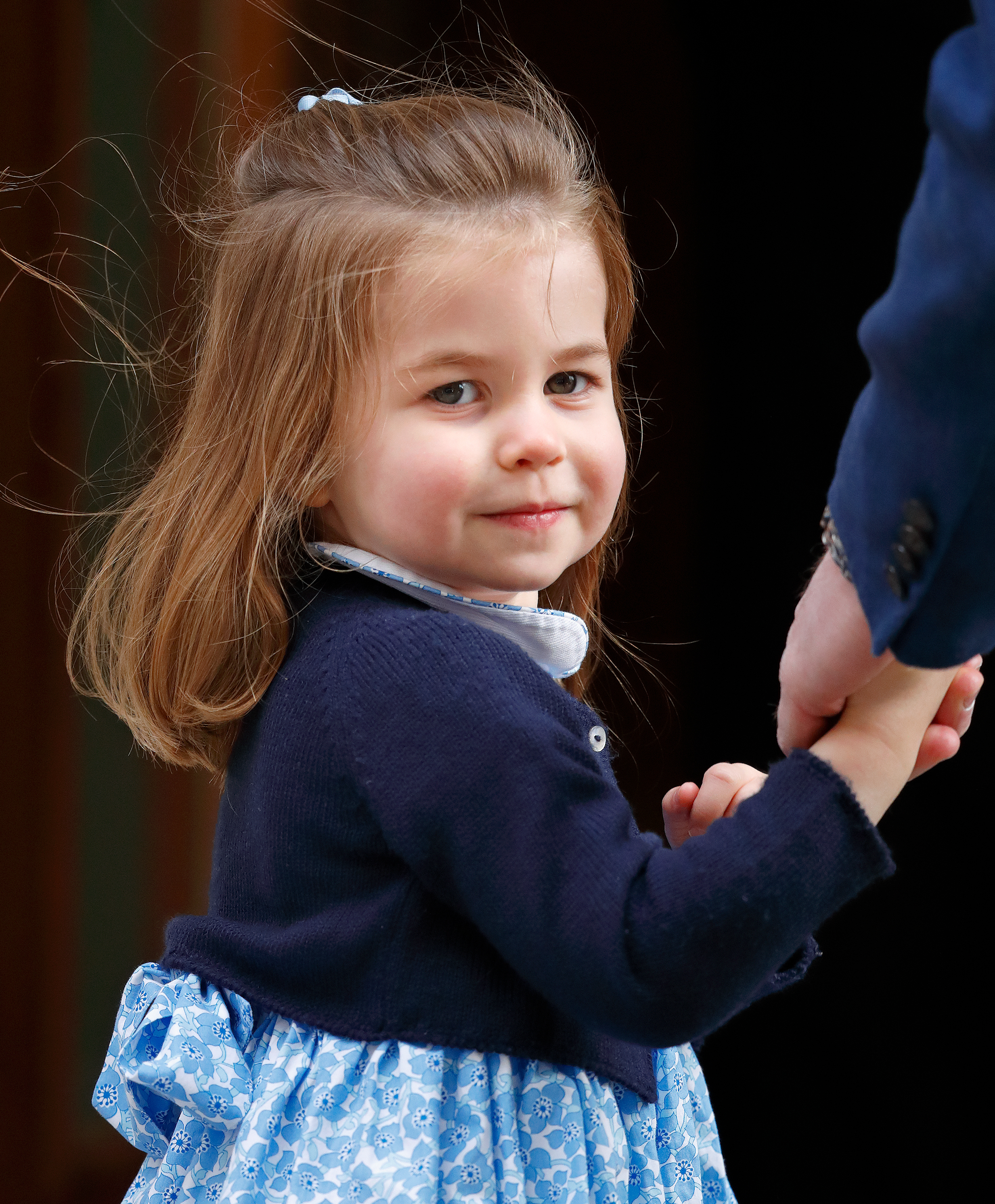 <p>Princess Charlotte flashed a smile to the assembled media as she and dad <a href="https://www.wonderwall.com/celebrity/profiles/overview/prince-william-482.article">Prince William</a> arrived at St. Mary's Hospital in London to visit <a href="https://www.wonderwall.com/celebrity/photos/prince-william-and-duchess-kate-debut-their-third-child-see-photos-young-family-3013892.gallery">newborn baby brother</a> Prince Louis on April 23, 2018.</p>