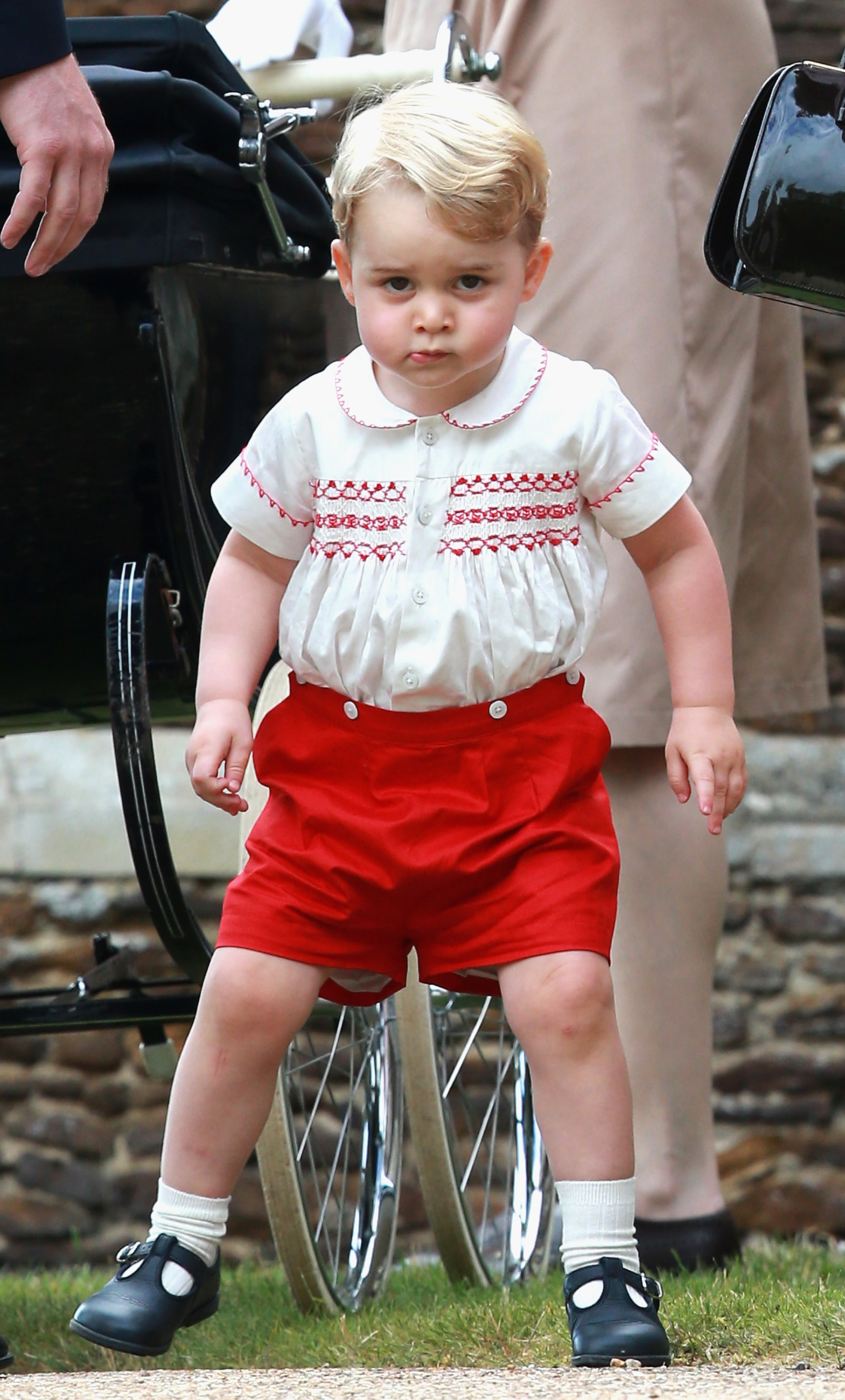 <p>Prince George meant business at little sister Princess Charlotte's christening at the Church of St. Mary Magdalene on the queen's Sandringham Estate on July 5, 2015.</p>