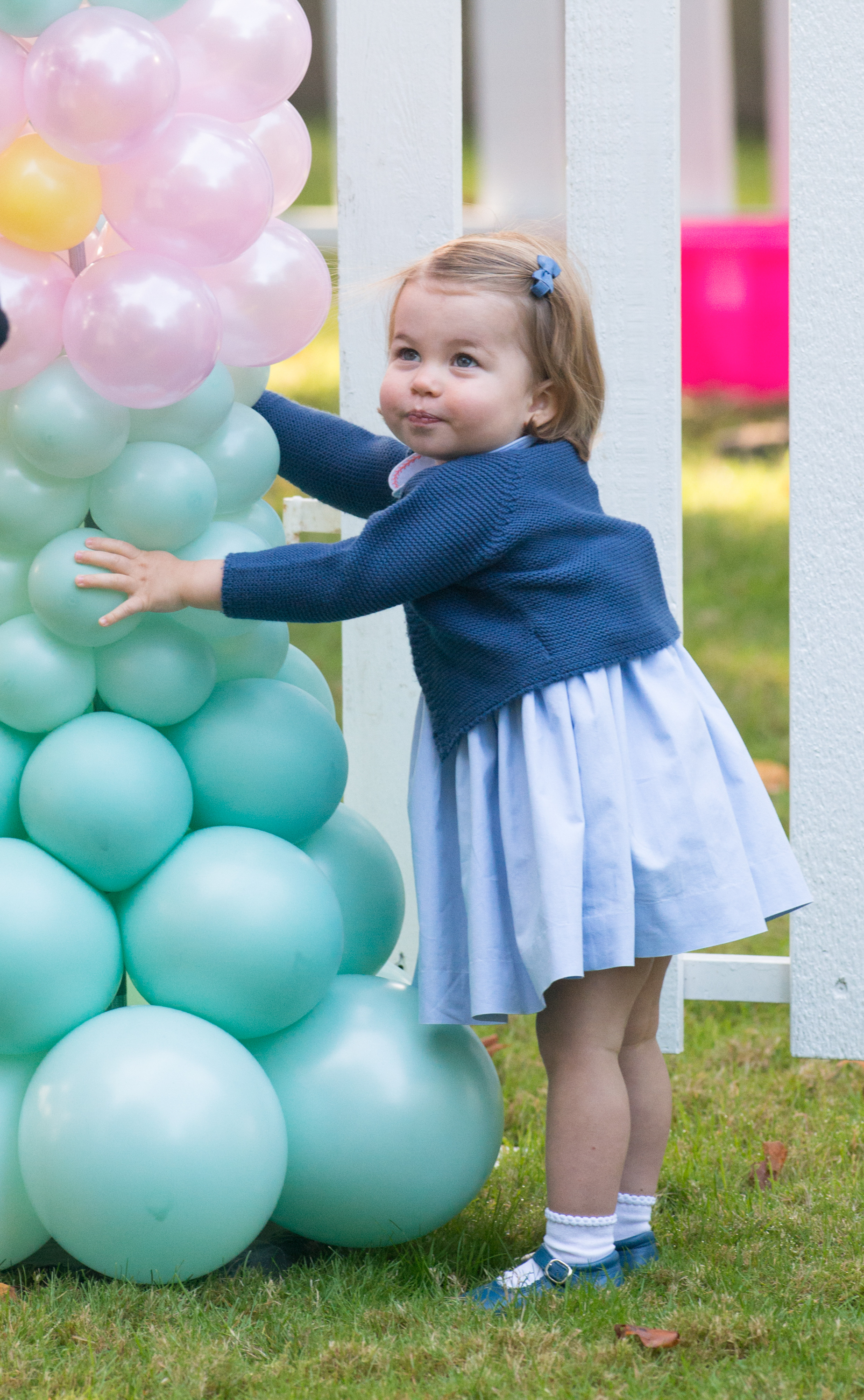 <p>Princess Charlotte played with balloons at a children's party for military families during her family's royal tour of Canada in Victoria on Sept. 29, 2016.</p>