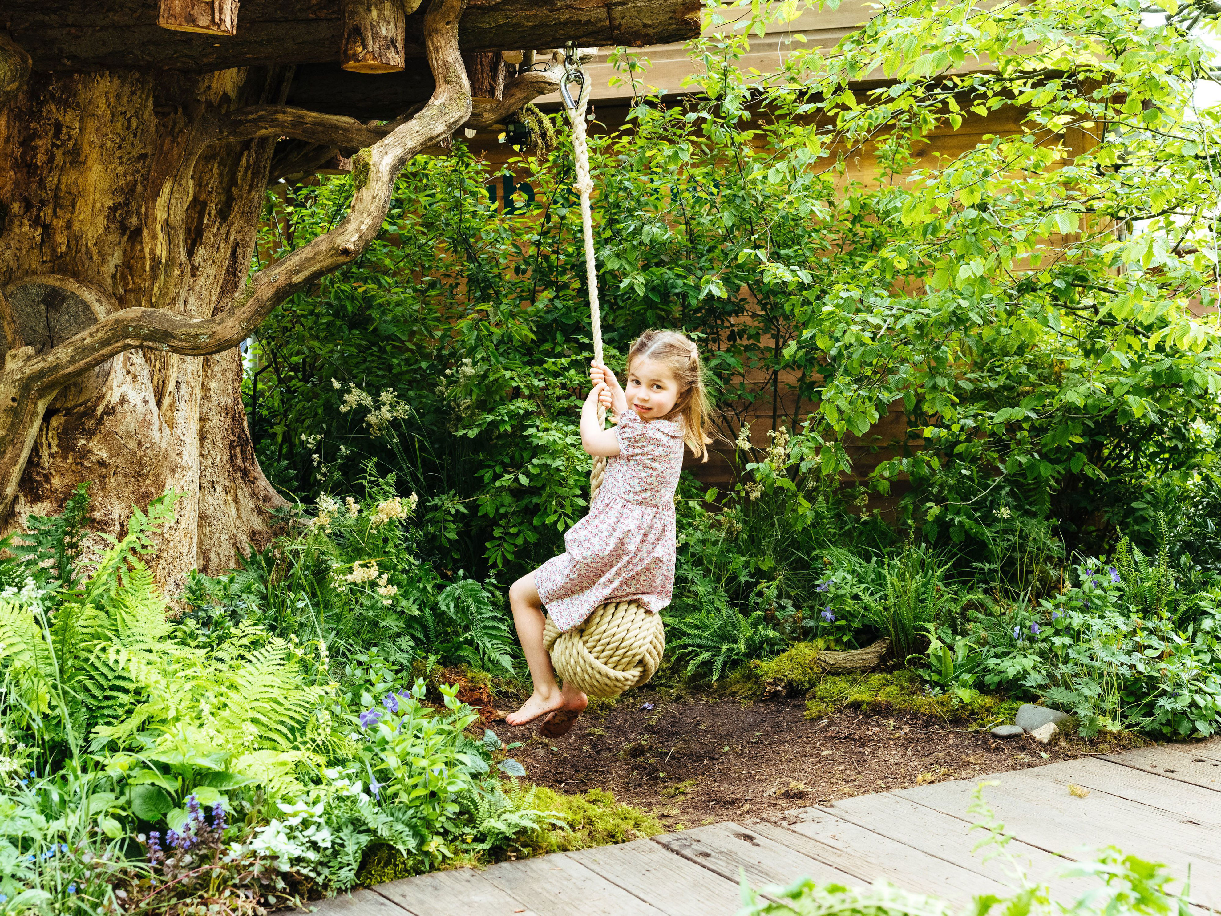 <p>Princess Charlotte played on a rope ball swing in the garden mom <a href="https://www.wonderwall.com/celebrity/profiles/overview/duchess-kate-1356.article">Duchess Kate</a> co-designed with Adam White and Andree Davies for the RHS Chelsea Flower Show in London on May 19, 2019.</p>
