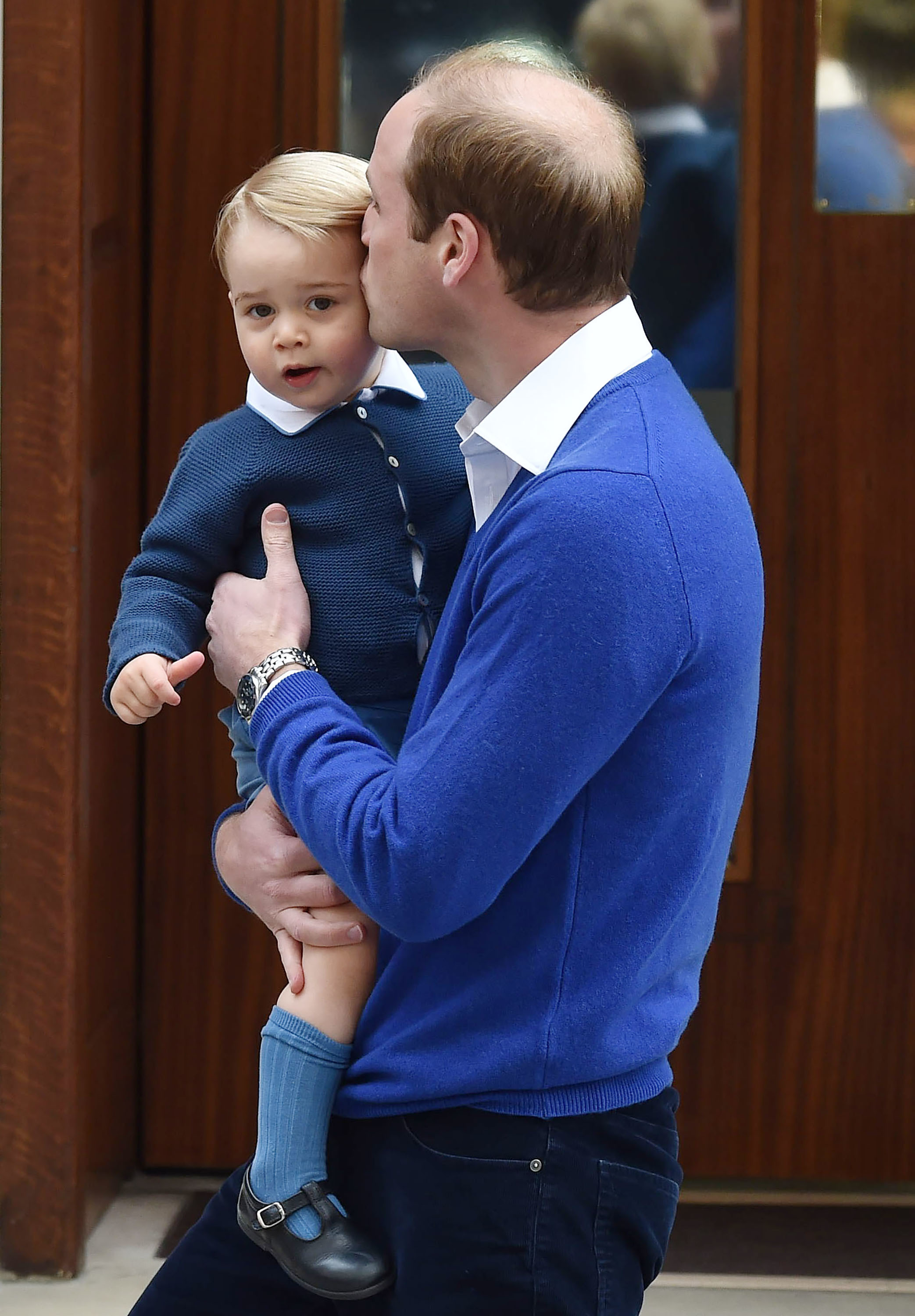 <p><a href="https://www.wonderwall.com/celebrity/profiles/overview/prince-william-482.article">Prince William</a> kissed Prince George outside the Lindo Wing at St. Mary's Hospital in London after the birth of Princess Charlotte on May 2, 2015.</p>