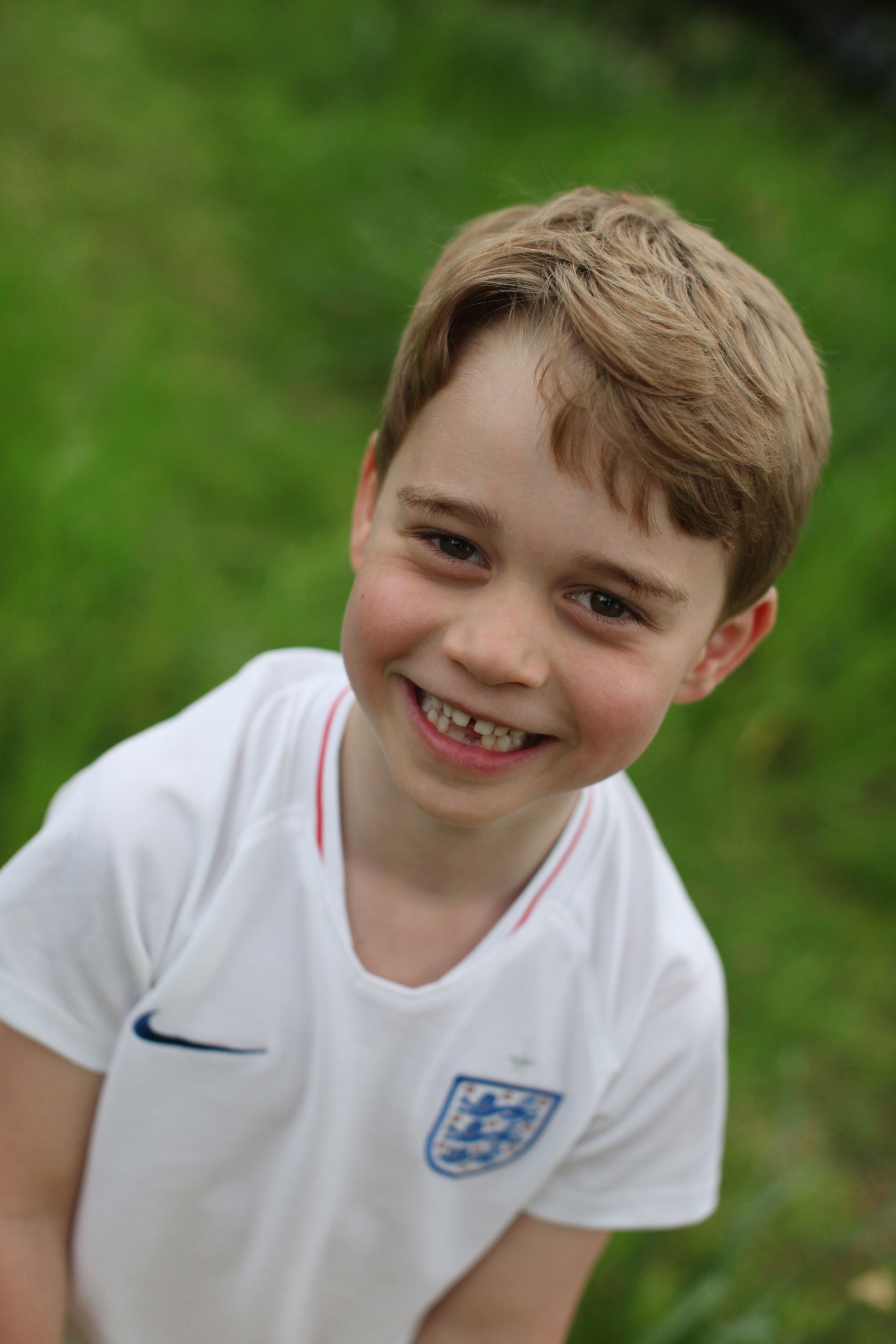 <p>Prince George is seen smiling in a photo taken by his mother in the garden at Kensington Palace to celebrate his 6th birthday on July 22, 2019.</p>