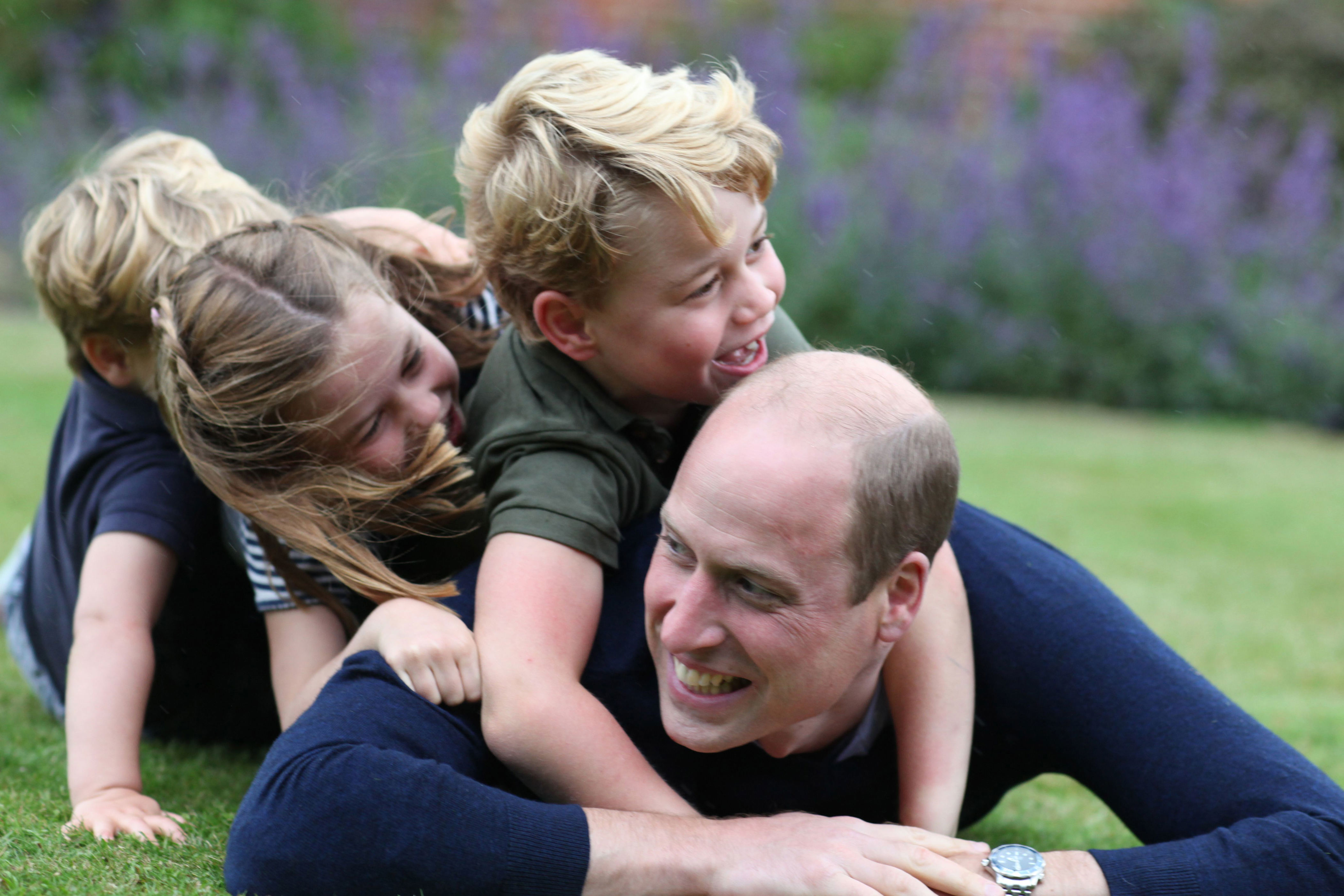 <p>This playful snapshot of the adorable trio horsing around with dad <a href="https://www.wonderwall.com/celebrity/profiles/overview/prince-william-482.article">Prince William</a> in Norfolk, England, in June 2020 was snapped by <a href="https://www.wonderwall.com/celebrity/profiles/overview/duchess-kate-1356.article">Duchess Kate</a> and shared by Kensington Palace in honor of the Duke of Cambridge's 38th birthday on June 21 -- which happened to fall on Father's Day. </p>