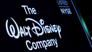 A screen shows the logo and a ticker symbol for The Walt Disney Company on the floor of the New York Stock Exchange (NYSE) in New York, Dec. 14, 2017. REUTERS/Brendan McDermid