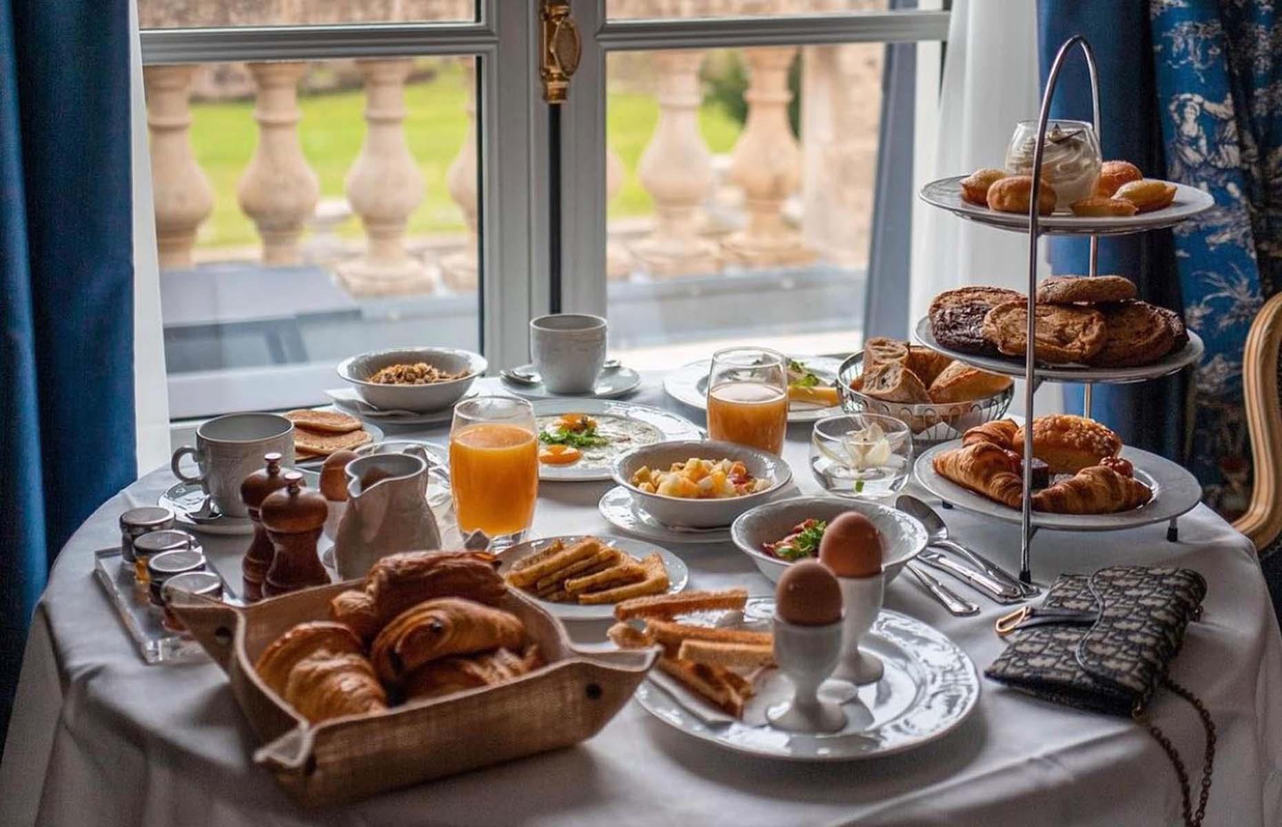<p>Set within the grounds of an opulent château, <a href="https://aubergedujeudepaumechantilly.fr/">Auberge du Jeu de Paume</a> unsurprisingly delivers a breakfast fit for royalty. You have to pay extra for the privilege, but when previous visitors consistently rave about the breakfast, something makes us think it’s worth the splurge. It's a decadent continental buffet affair, covering all the usual suspects that can either be enjoyed in the comfort of your room, on the private terrace of your suite or in the hotel’s marble-floored restaurant.</p>