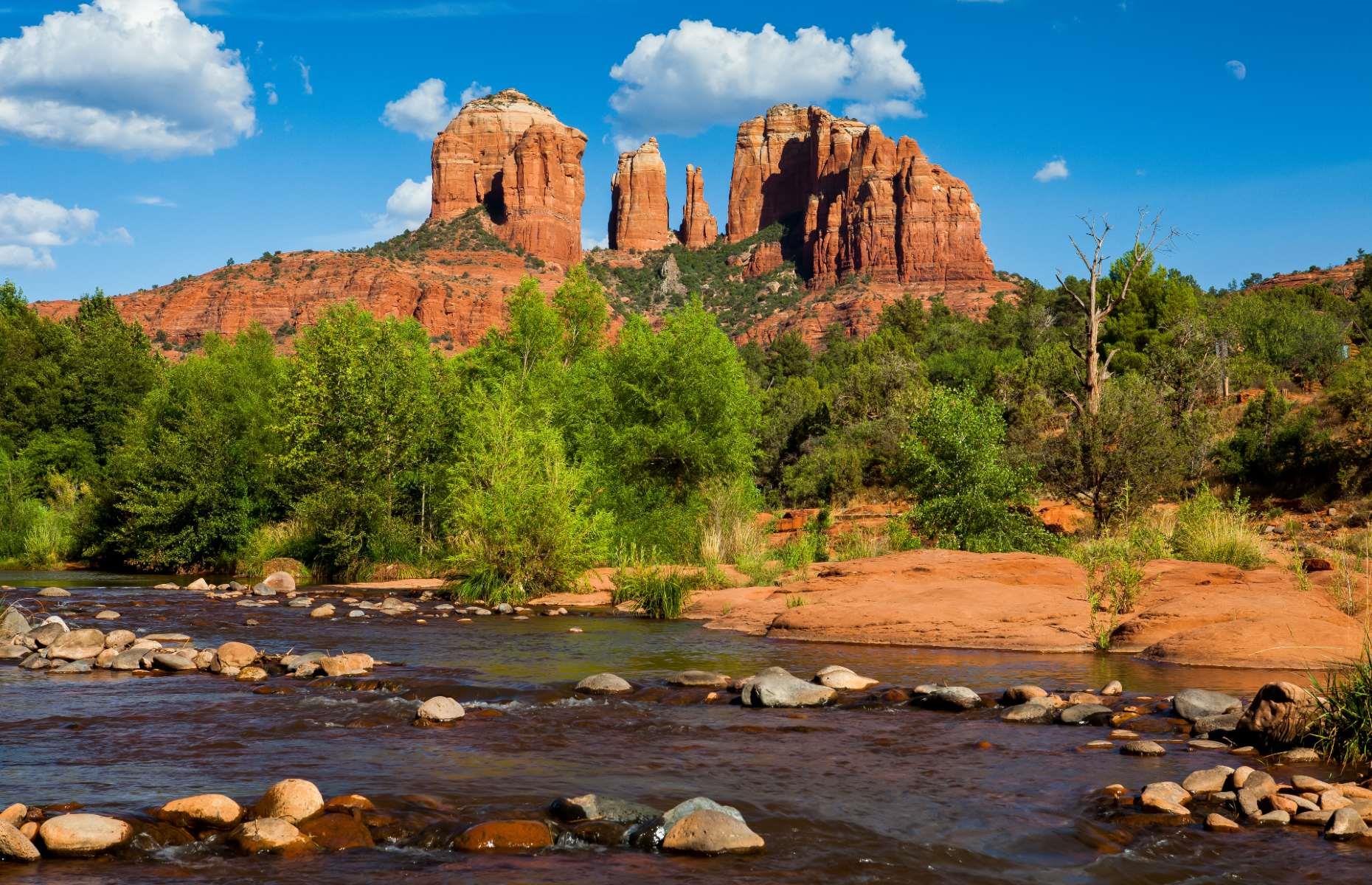 <p>A magnet for outdoorsy types, Sedona enjoys a picturesque location at the base of Oak Creek Canyon, surrounded by 1.8 million acres of national forest land. You could easily get swept away in all the activities to be enjoyed nearby, from hiking and biking to rafting and fishing, but the town itself is also well worth exploring. Thanks to its longstanding connection to the art world – surrealist painter Max Ernst and his wife Dorothea Tanning moved here in the 1940s – there are more than 80 galleries to explore, as well as street art and performing arts centers.</p>
