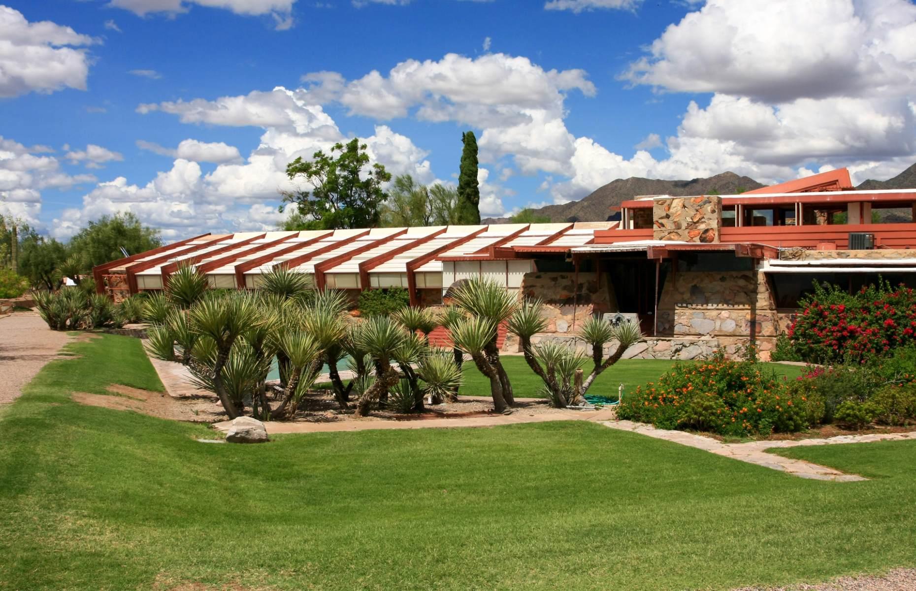 <p>Influential American architect Frank Lloyd Wright was the brains behind this striking building, located at the foot of the McDowell Mountains near Scottsdale. After buying a plot of land, Wright began work on <a href="https://franklloydwright.org/taliesin-west/">Taliesin West</a> in 1937, wishing to create a winter retreat for himself and his students. He wanted the structure to reflect its surroundings, so he gave it canvas rooftops to ensure it got optimum sunlight, surrounded it with local rocks and sand, and used redwood beams to echo the desert’s color palette. Today, visitors can take guided or self-guided tours around the building to learn about Wright’s life and legacy.</p>