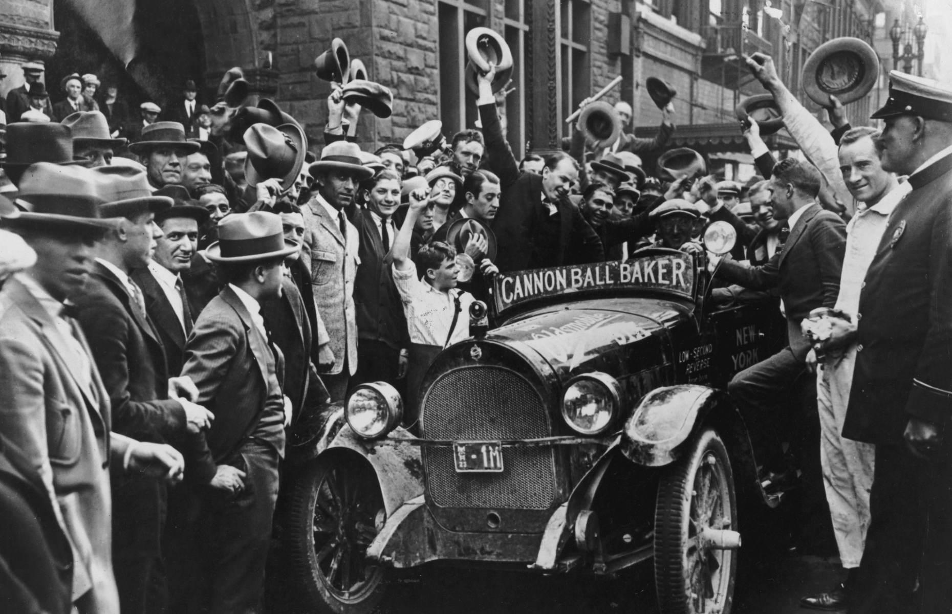 <p>While road trips may have been a way to unwind for many, motorcyclist and car racer Erwin Baker turned these cross-country journeys up a notch – by driving as fast as he could. In fact, he even earned the name “Cannonball”, after a newspaper compared him to a Cannonball Express train during one of his famous cross-country races. Shown here in 1923, in his Oldsmobile 30A surrounded by fans, the racer had just completed a trip from New York to Los Angeles by motocycle in a record-breaking 12-and-a-half days. </p>