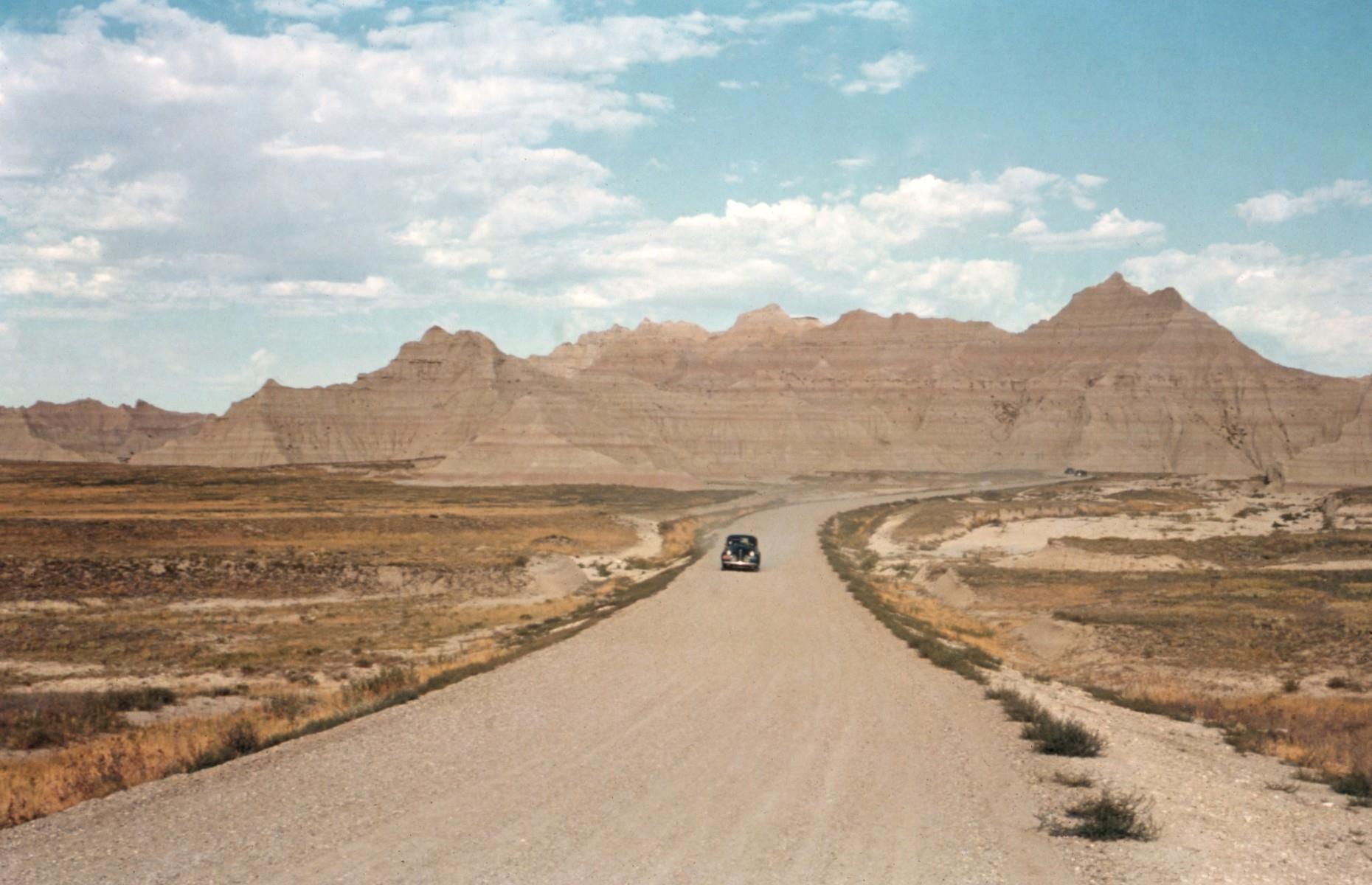 <p>The striated peaks of the Badlands, South Dakota are just as striking in this rudimentary color photograph as they are today. The national park (then a national monument) was located close to US Highways 14 and 6, so when roads were built through it during the 1930s and 1940s there was a significant uptick in visitor numbers.</p>  <p><a href="https://www.loveexploring.com/galleries/121388/historic-images-of-world-famous-holiday-destinations?page=1"><strong>Next, check out these vintage photographs of world-famous destinations</strong></a></p>