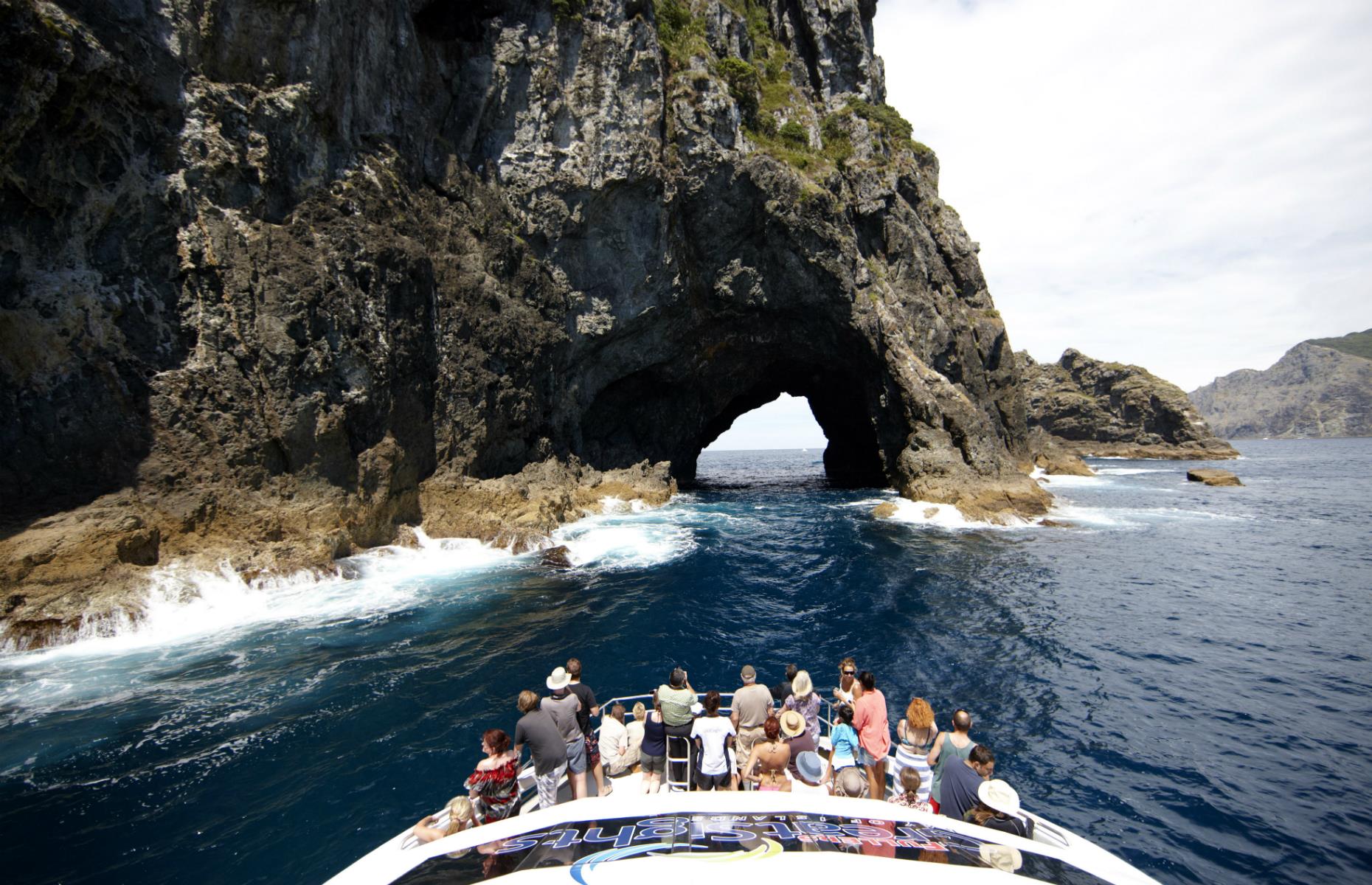 <p>The Bay of Islands is a watery wonderland with more than 100 offshore subtropical islands to explore. The talisman of the region is the Hole in the Rock (Piercy Island) – a spectacular rock formation that is possible to cruise right through on a calm day. <a href="https://www.intercity.co.nz/flexipass-hole-in-the-rock-cruise">Half-day tours</a> leave from Paihia.</p>