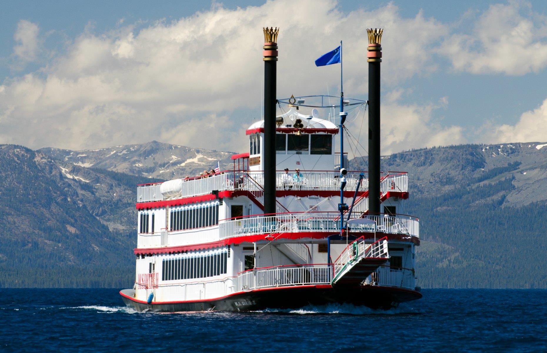 <p>Say hello to one of America’s most spectacular lake cruises. Your mode of transport for this sail across Lake Tahoe will be the <a href="https://tahoesouth.com/boats/m-s-dixie-ii-paddlewheeler/">M.S Dixie II</a> – the lake’s biggest boat. The sunset dinner cruises are popular with couples, although we recommend the scenic daytime tours, which are a great way to explore North America’s largest alpine lake. This high-altitude body of water spreads into two states (California and Nevada), contains enough water to cover California with 14 inches of water and is deeper than the Empire State Building is tall.  </p>