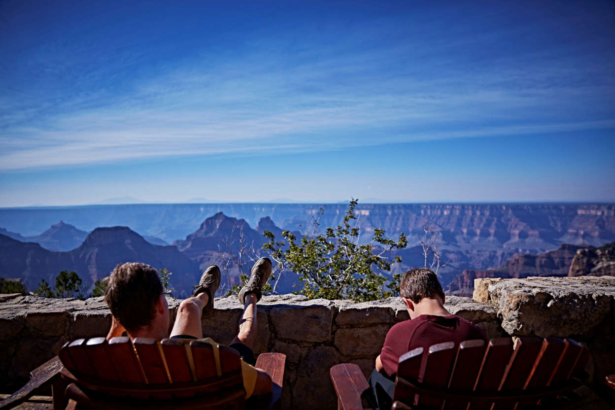 Slide 3 of 17: Pull up an Adirondack chair and enjoy the view from the patio of the Grand Canyon North Rim Lodge.