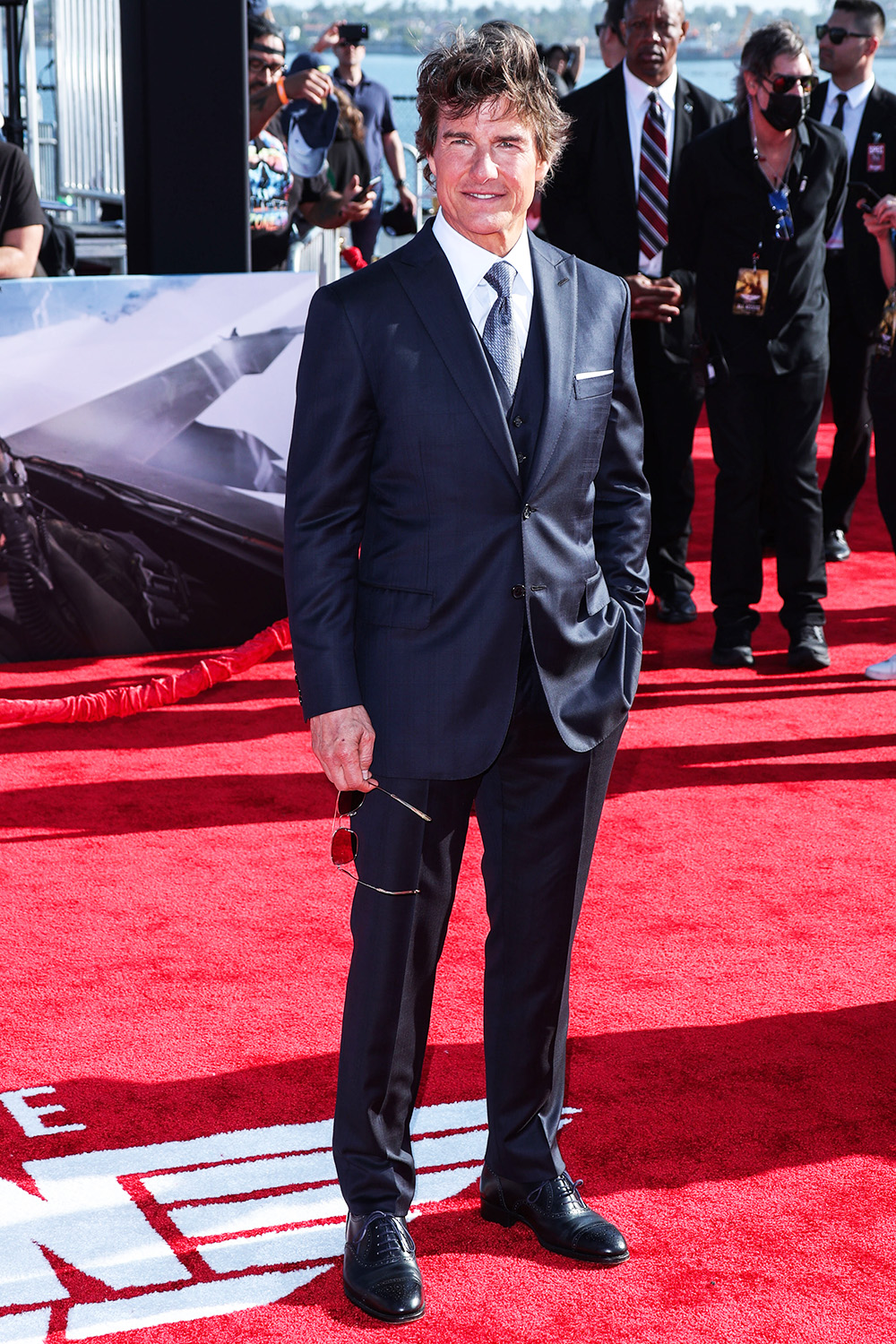 <p>Tom Cruise was so handsome in a navy blue suit at the world premiere of ‘Top Gun: Maverick’ on May 4, 2022. The event was held at the USS Midway Museum in San Diego, California.</p>