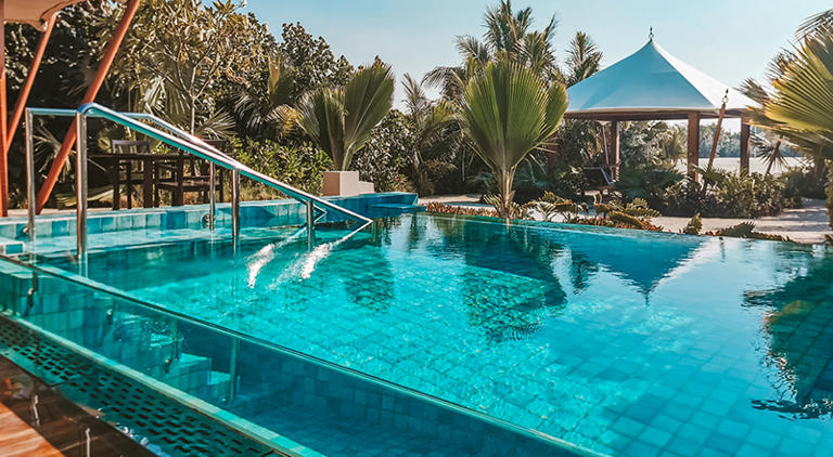 pool villa ritz carlton al hamra featured