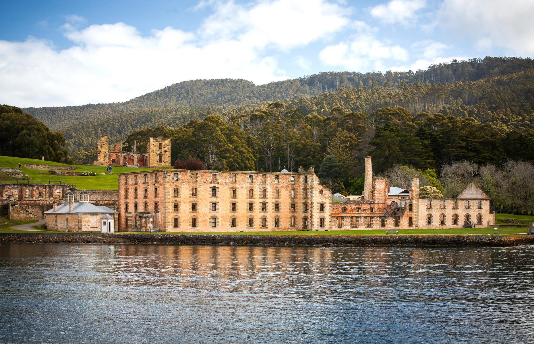 <p>A wretched place established on the wilds of the Tasman Peninsula, Port Arthur was one of the harshest and largest convict settlements in all of Australia. It closed in 1877 and was renamed Carnarvon for a time, with land auctioned in the 1880s and people taking up residence in and around the old site to form a new township. Fires in 1895 and 1897 destroyed many buildings and gutted its Penitentiary, Separate Prison and Hospital. Today the complex of ruins is a foreboding but fascinating place to explore.</p>