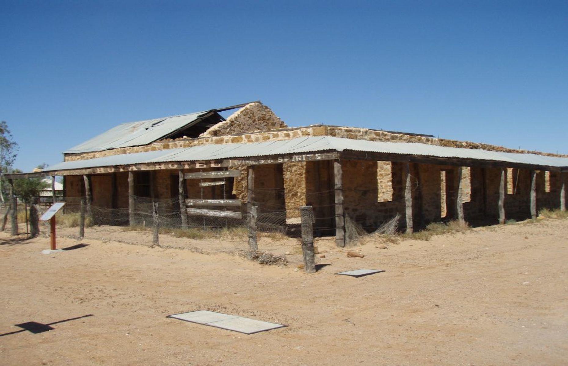 <p>Withered and weathered, the long abandoned Royal Hotel is one of a scattering of historic buildings around Birdsville. It lies on the edge of the fascinating frontier town at the end of the old drovers’ route, the Birdsville Track, on the edge of the Simpson Desert. Now National Trust-listed, the dilapidated 1880s-built building began life as a hotel but was used as a hospital by the Royal Flying Doctor Service before becoming a private home for a time. </p>