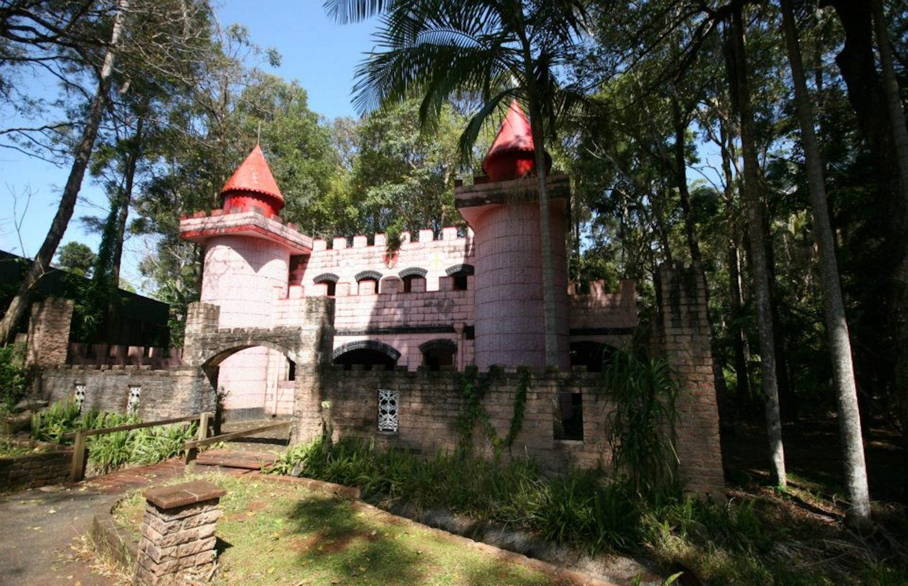 <p>Snow White’s cottage, Cinderella’s castle and the Old Woman’s shoe lie empty and shrouded in bushland near Port Macquarie. These abandoned structures were part of a fairy tale-themed amusement park that opened in the Sixties and fell into disrepair after its owners retired in the 1980s. A new owner came along in 2015 and gave some of the vandalized buildings a refresh with plans to restore it to a vacation cabin park. But concerns the development could disturb the local koala population means the site remains sealed off.</p>