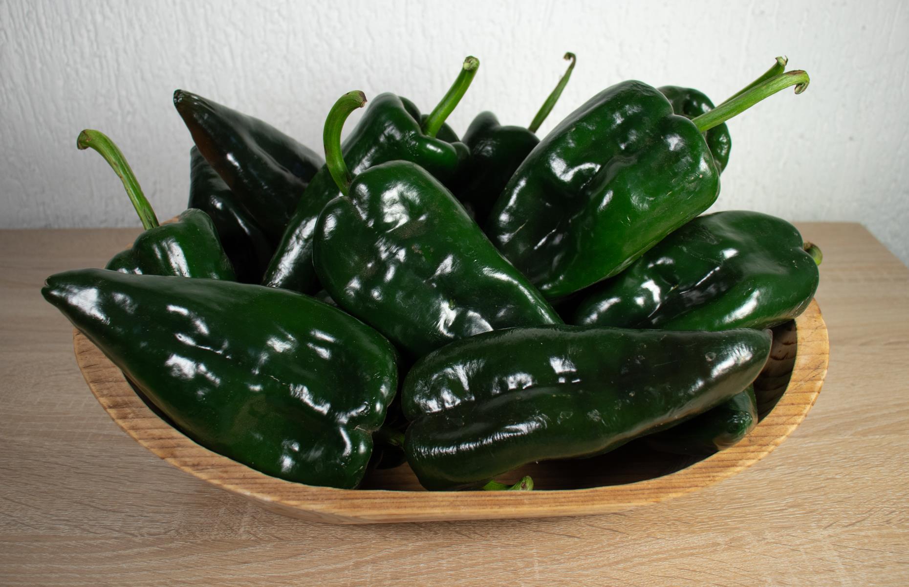<p>This is a big chili – nearly as large as a green pepper – and it's very popular in Mexico. It's mild and fruity, often featured in chili con carne, made into a creamy sauce or used as mole poblano (a sauce with chocolate served with meat). When dried, poblano becomes ancho chilies. Try our Mexican roast chicken dish, where ancho makes a marinade and it's served with a citrus slaw.</p>  <p><strong><a href="https://www.lovefood.com/recipes/112878/ancho-rub-pot-chicken-recipe">Get the recipe for ancho rub pot chicken here</a></strong></p>