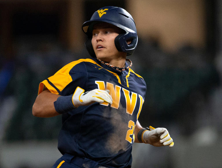 West Virginia all-American J.J. Wetherholt is back after an injury-related 26-game absence, and the Mountaineers moved into a tie for first place in the Big 12 on Sunday by completing a series sweep at Kansas.