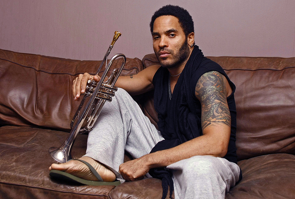 <p>Lenny Kravitz plays the trombone while backstage at Glasgow’s 02 Academy in Scotland on Jun. 26, 2009. He was relaxed in sweats and flip flips ahead of his concert.</p>